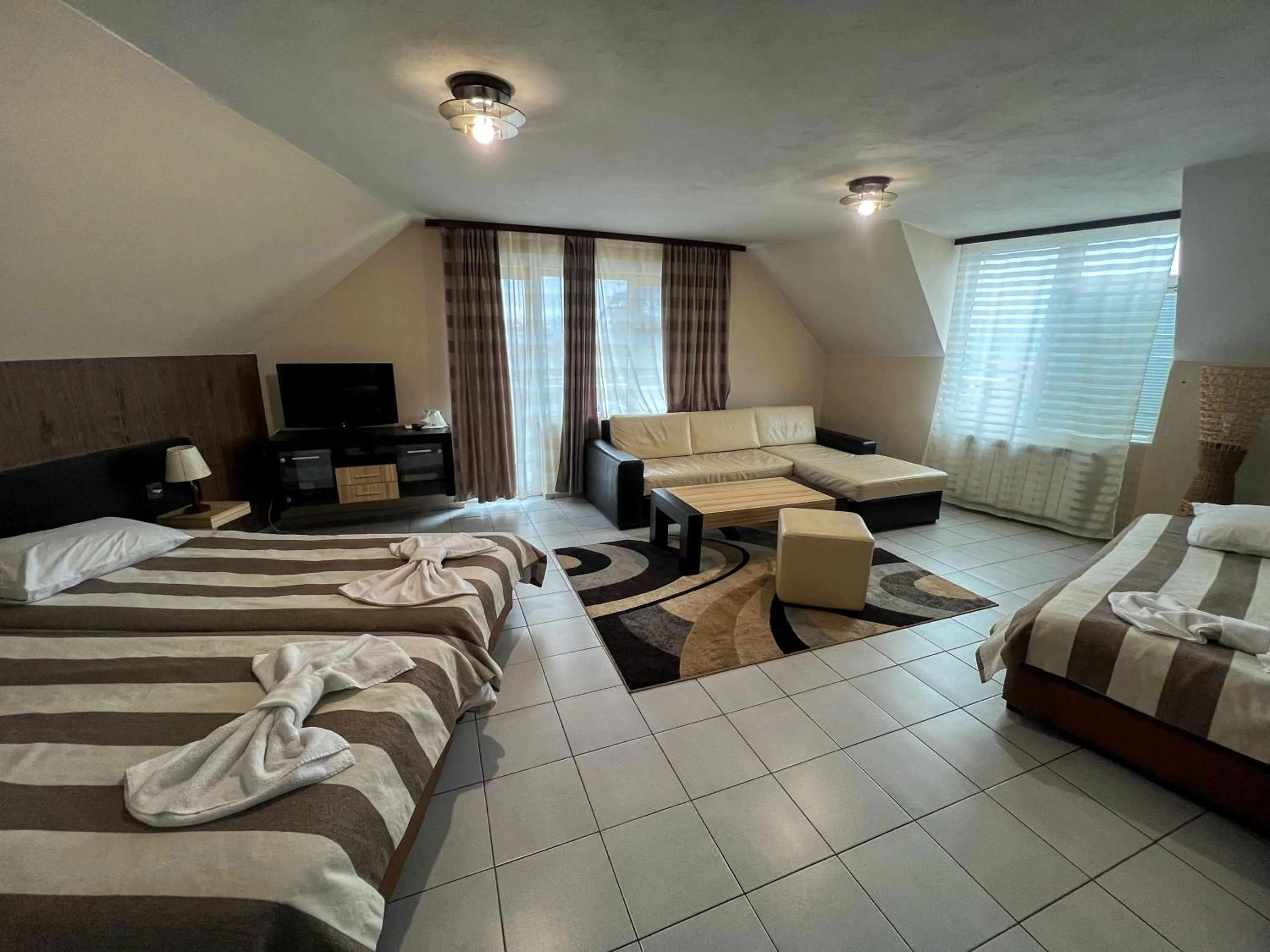 Bed in ALPHA family HOTEL