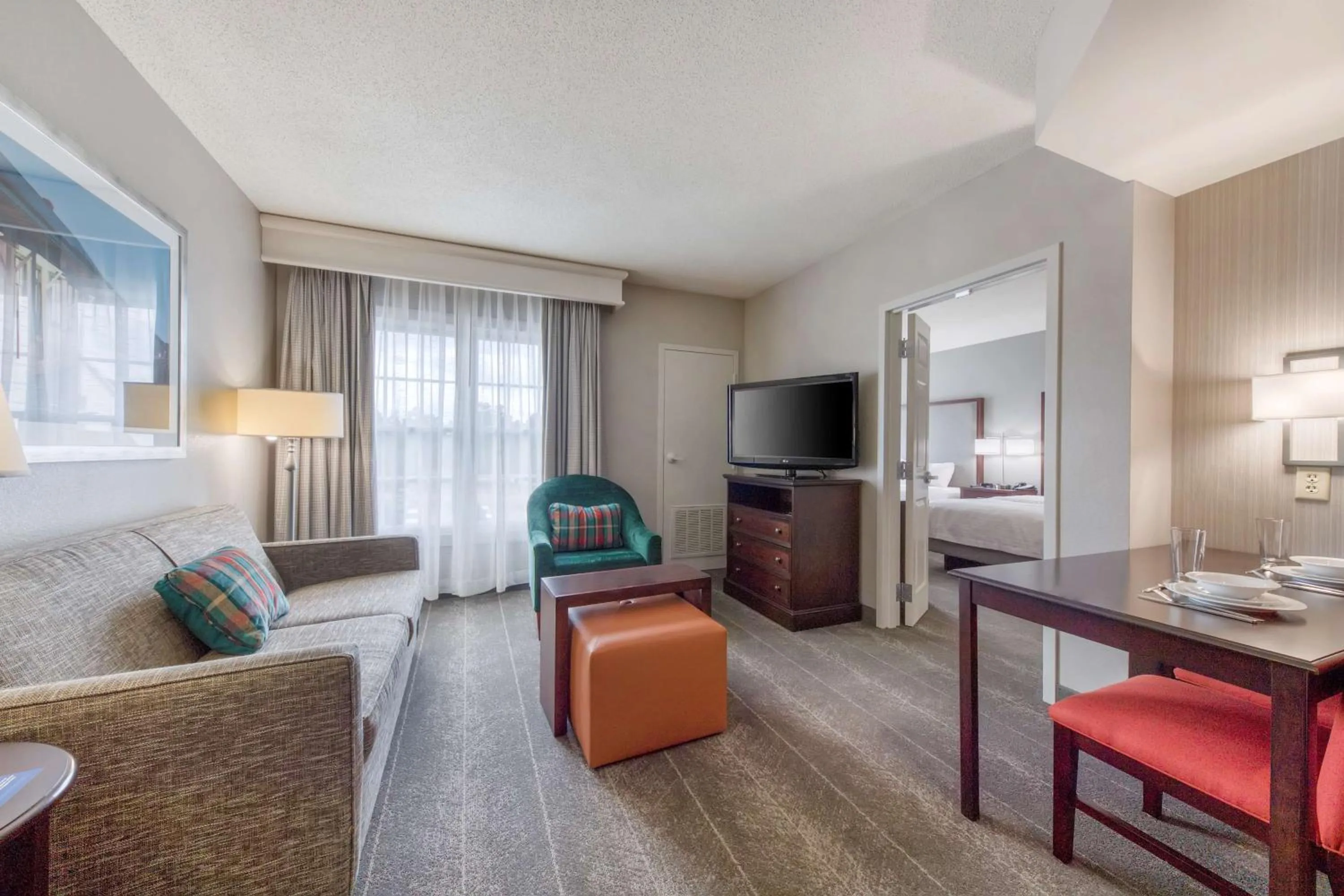 Living room, Bed in Homewood Suites by Hilton Olmsted Village
