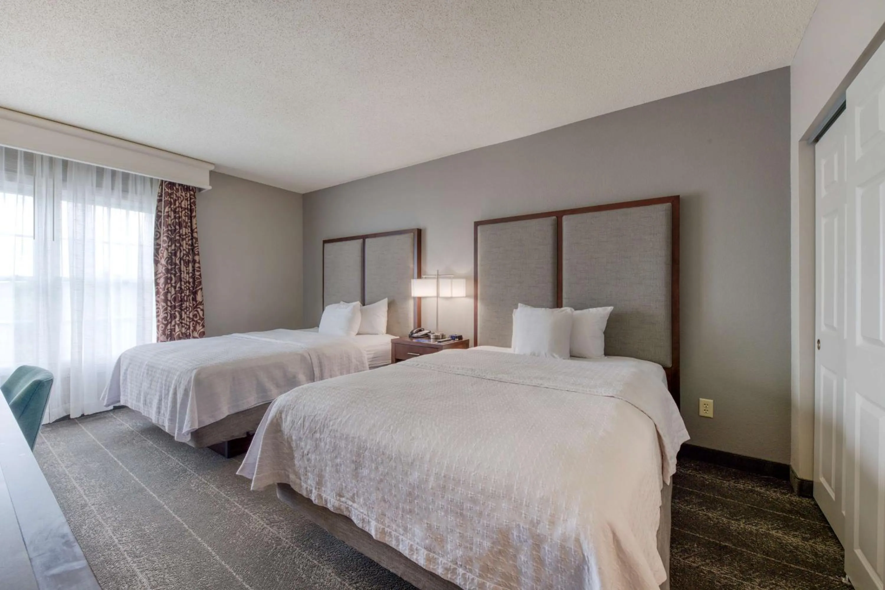 Bed in Homewood Suites by Hilton Olmsted Village