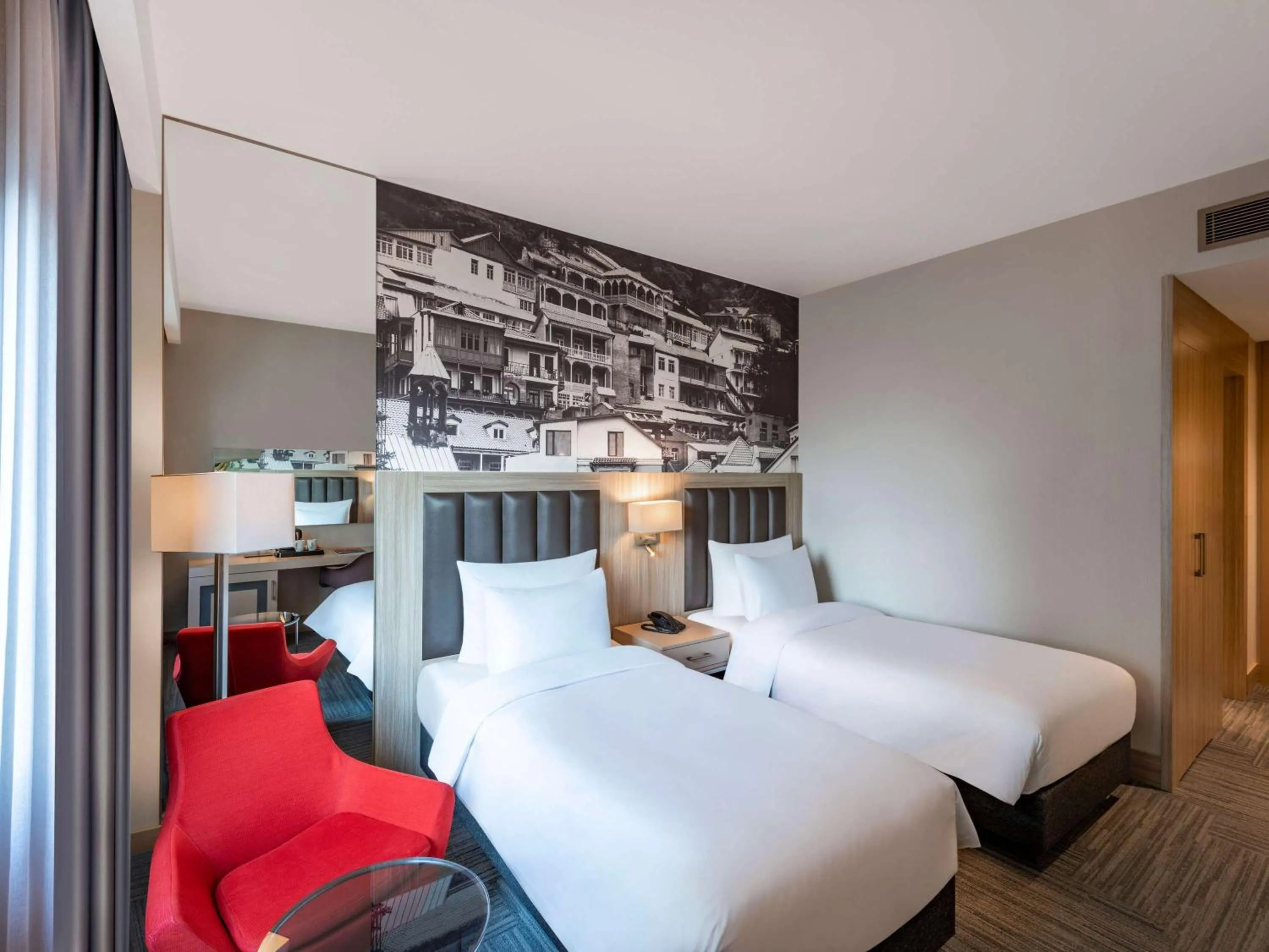 Bed in Ramada Encore Tbilisi