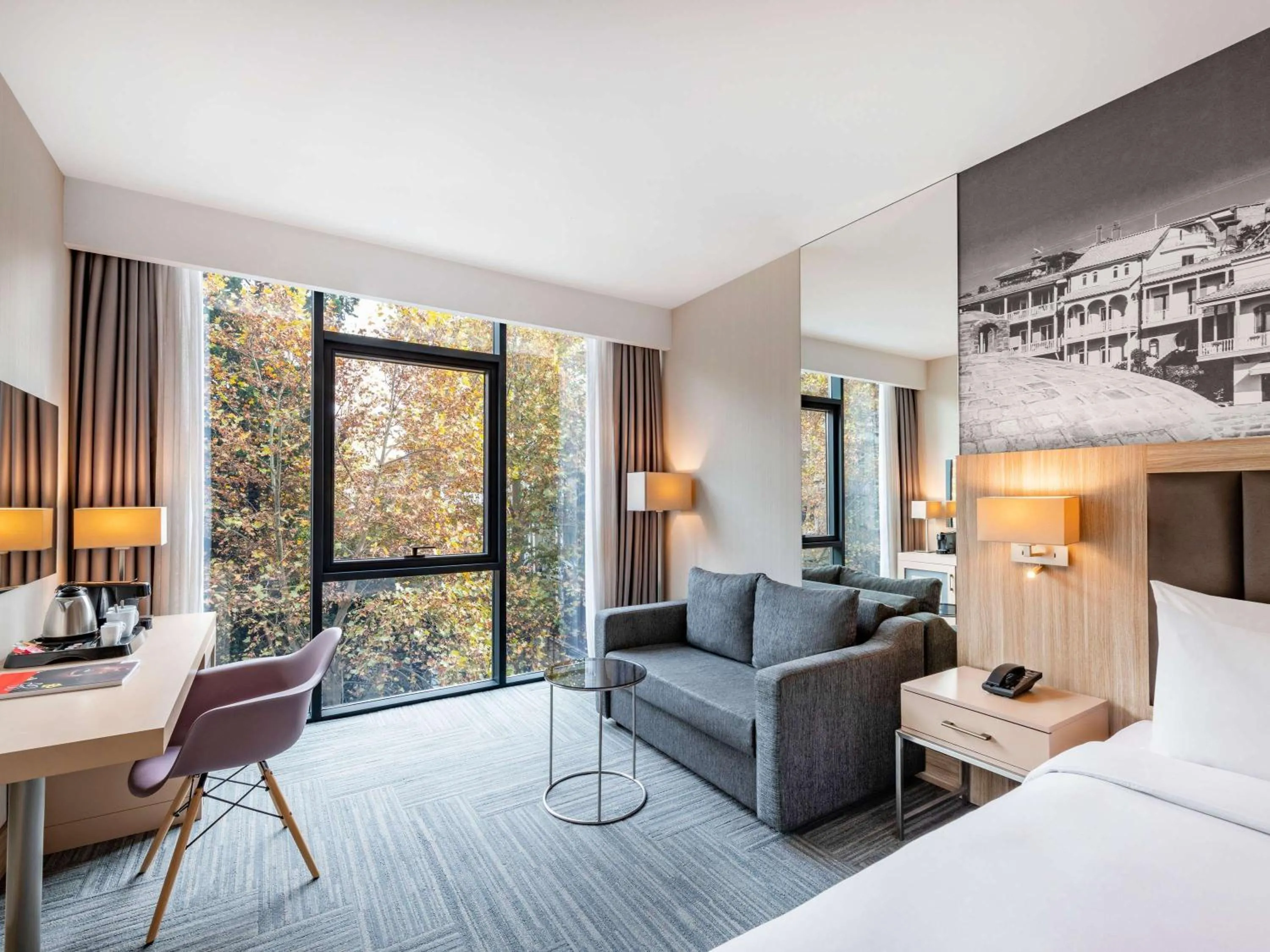 Seating area, Bed in Ramada Encore Tbilisi