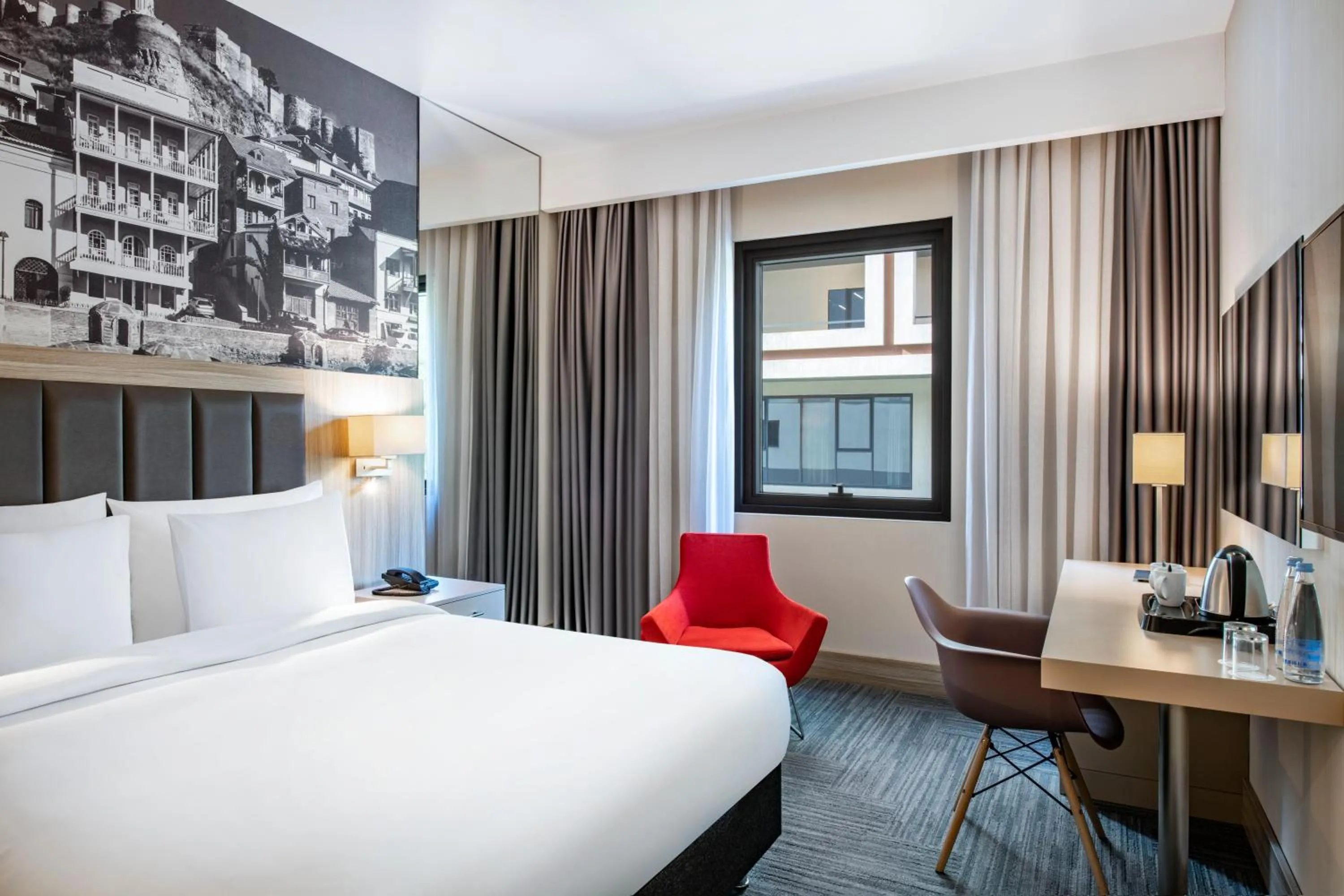 Bed in Ramada Encore Tbilisi