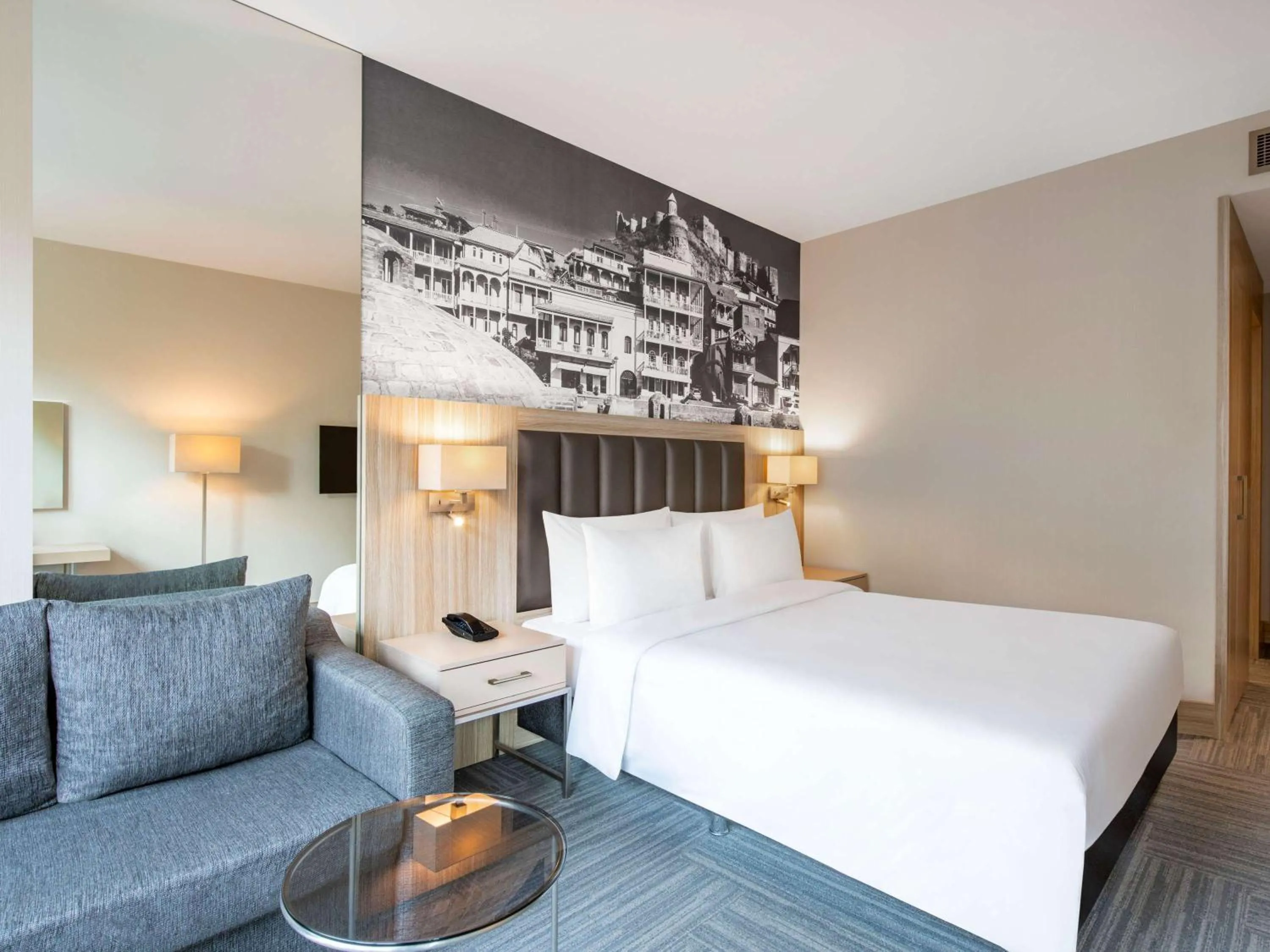 Bed in Ramada Encore Tbilisi