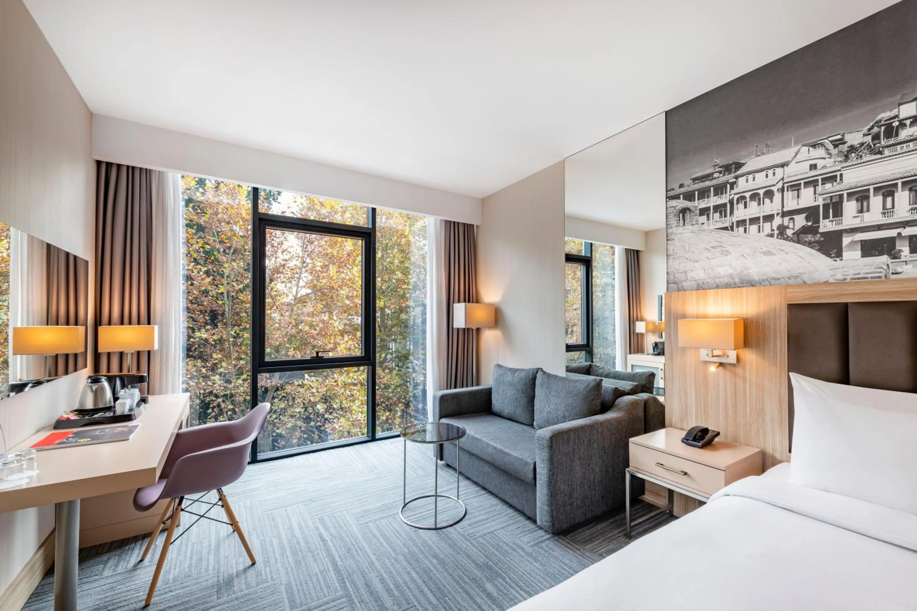 Bed in Ramada Encore Tbilisi