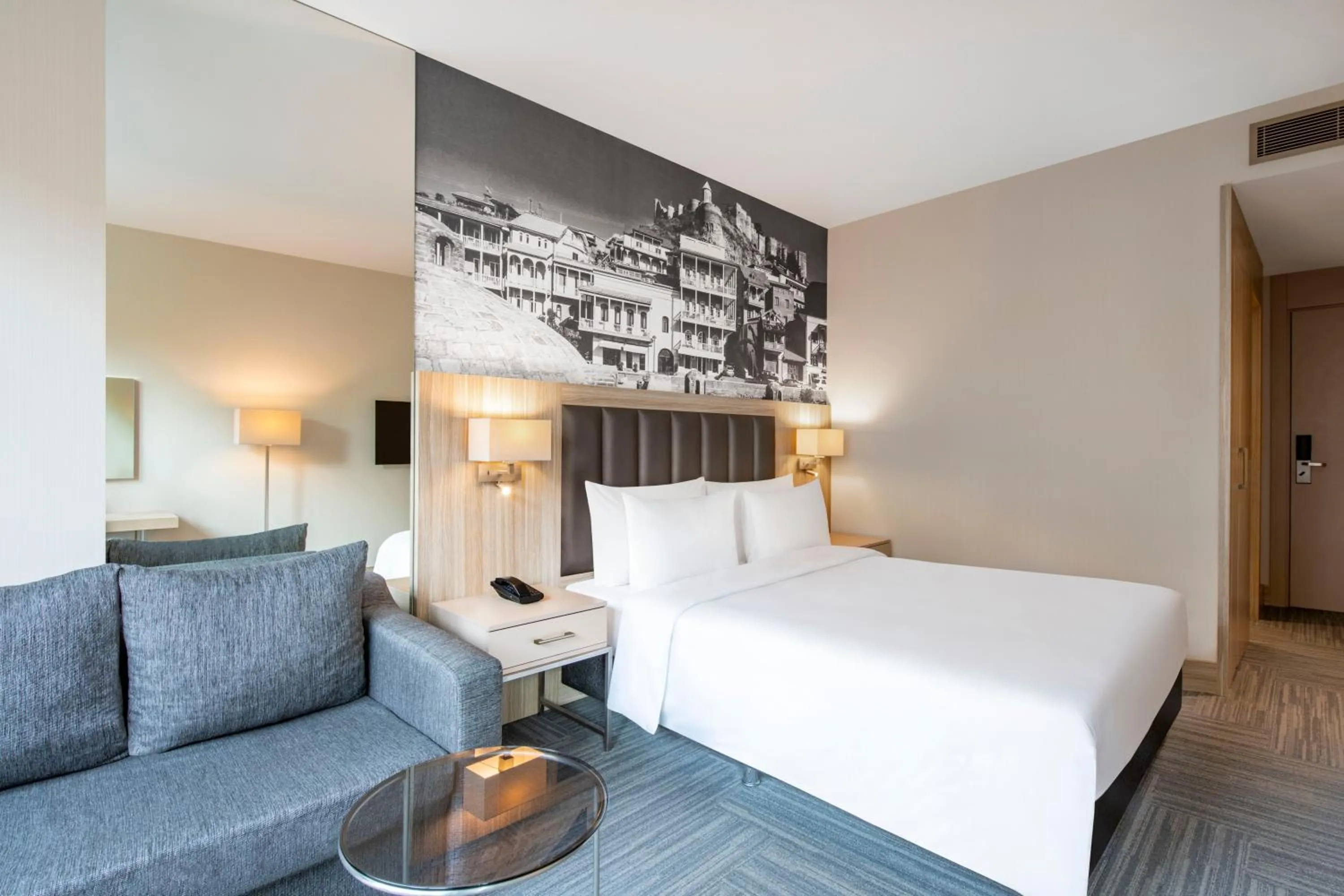 Bed in Ramada Encore Tbilisi