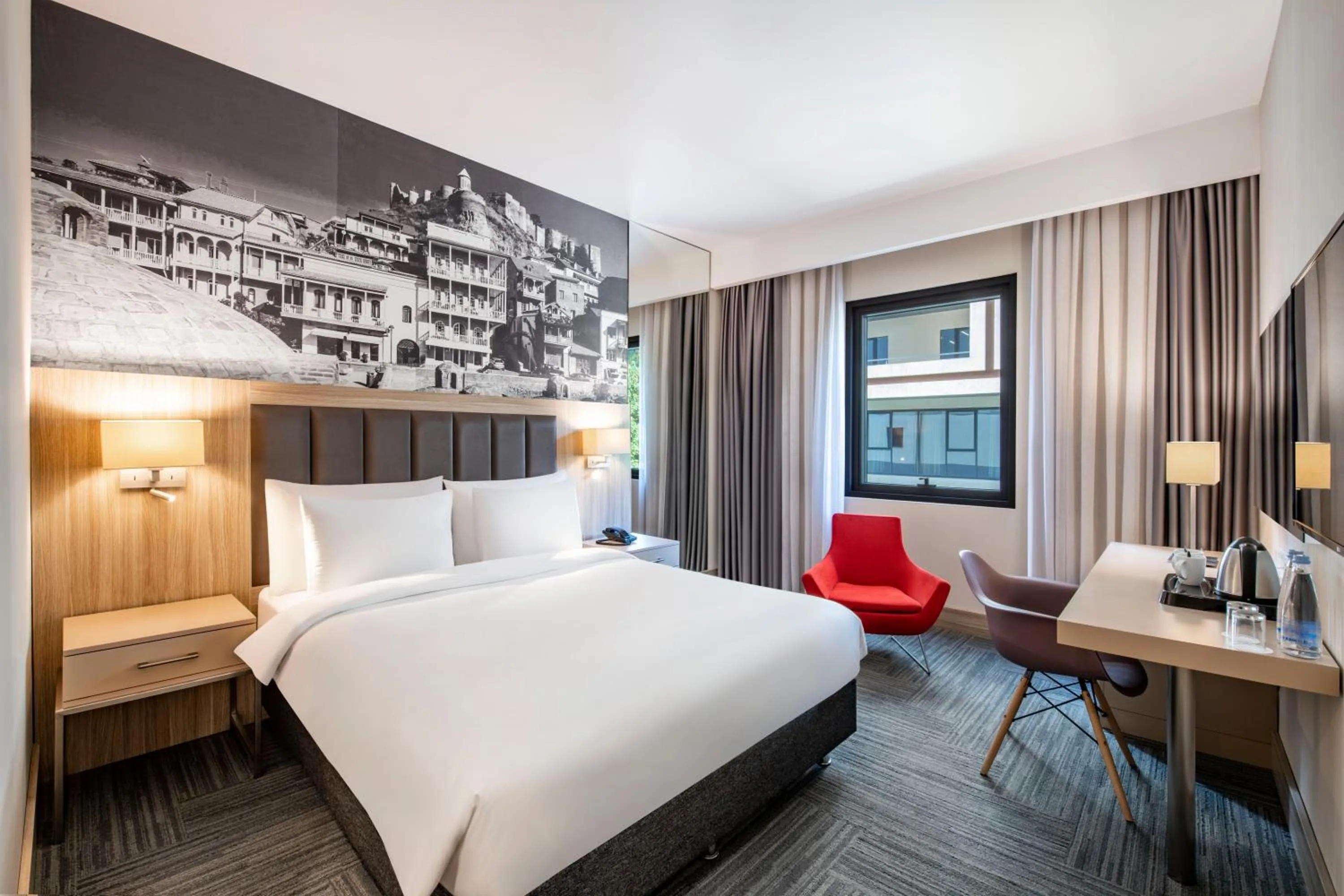 Bed in Ramada Encore Tbilisi