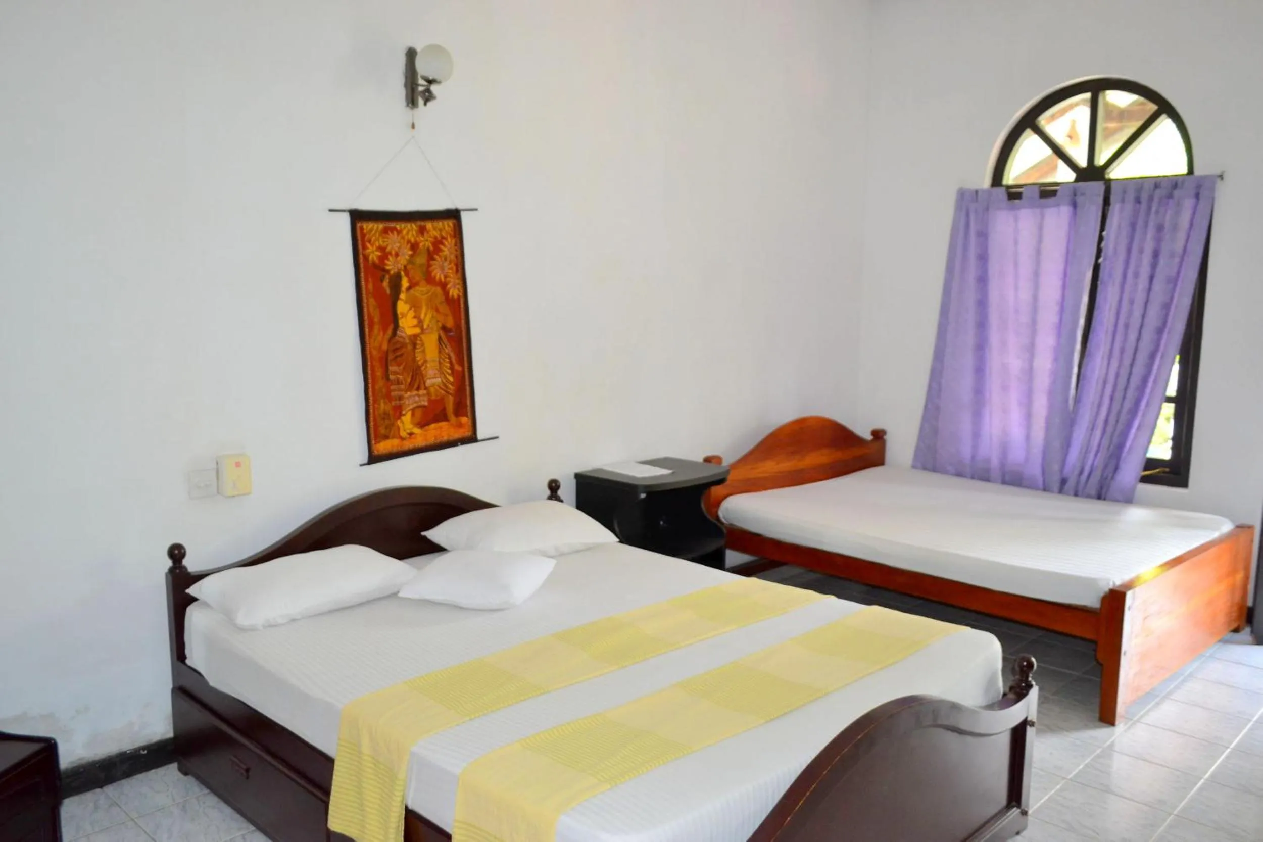 Bed in Hotel Breeta's Garden