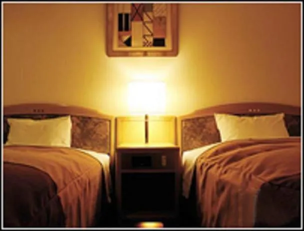 Bed in Hirosaki Plaza Hotel