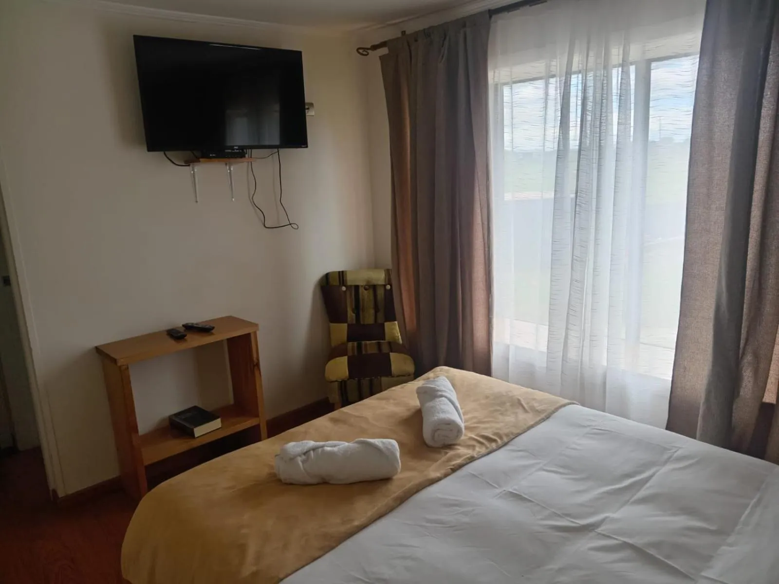 Photo of the whole room, Bed in Hostal Doble E Patagonia