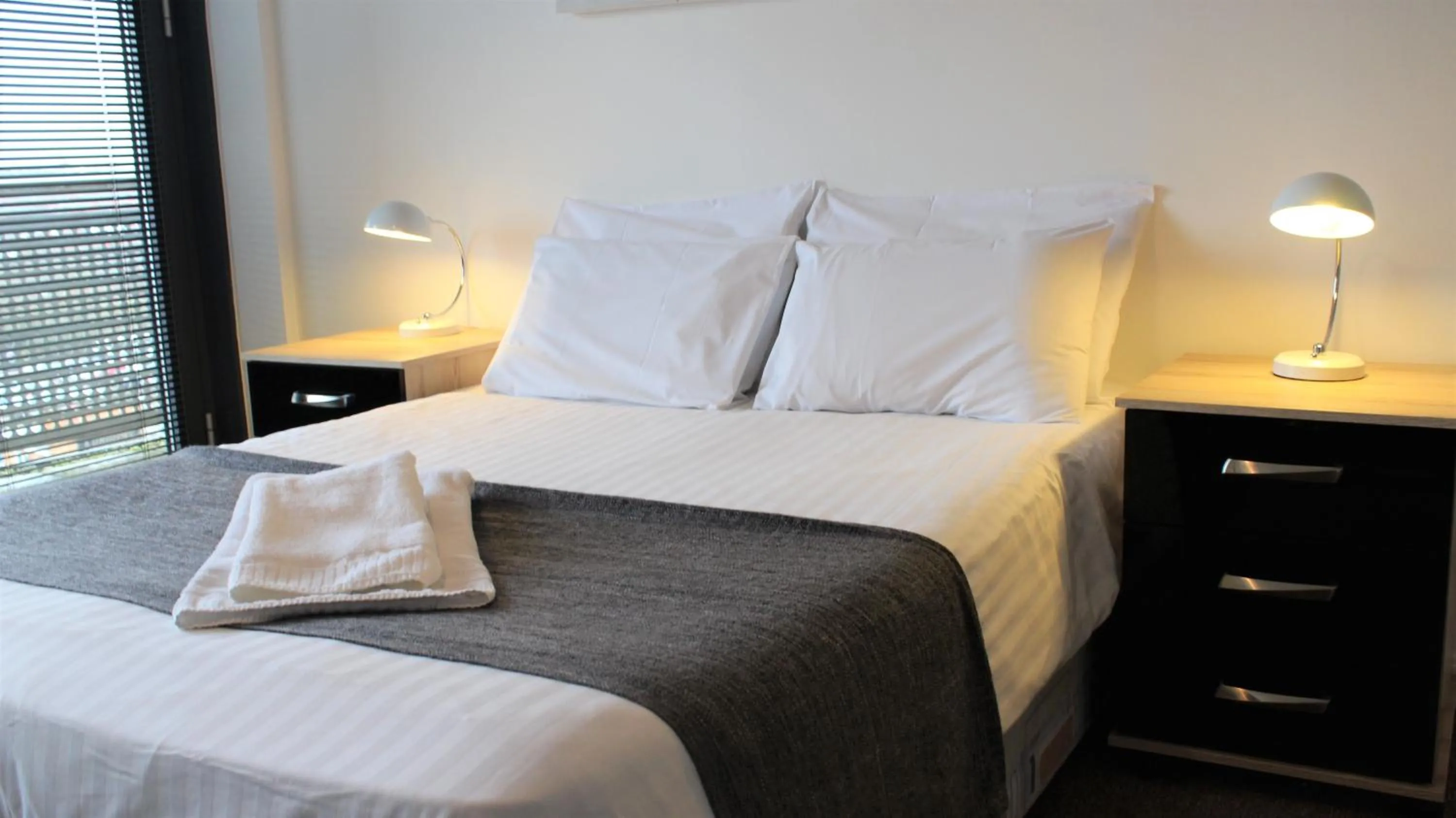 Bed in Empire Serviced Apartments