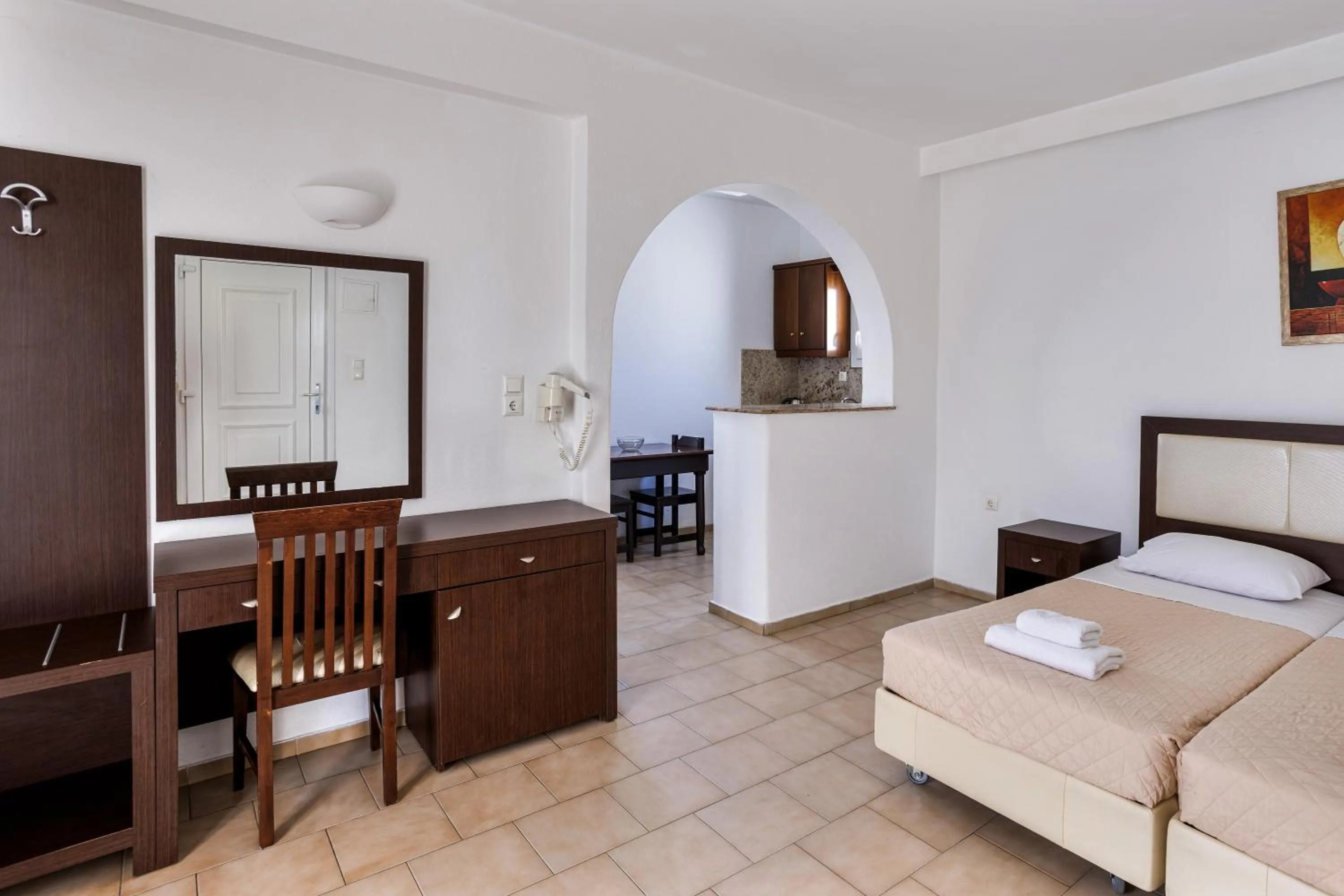 Bed in Elena Studios & Suites