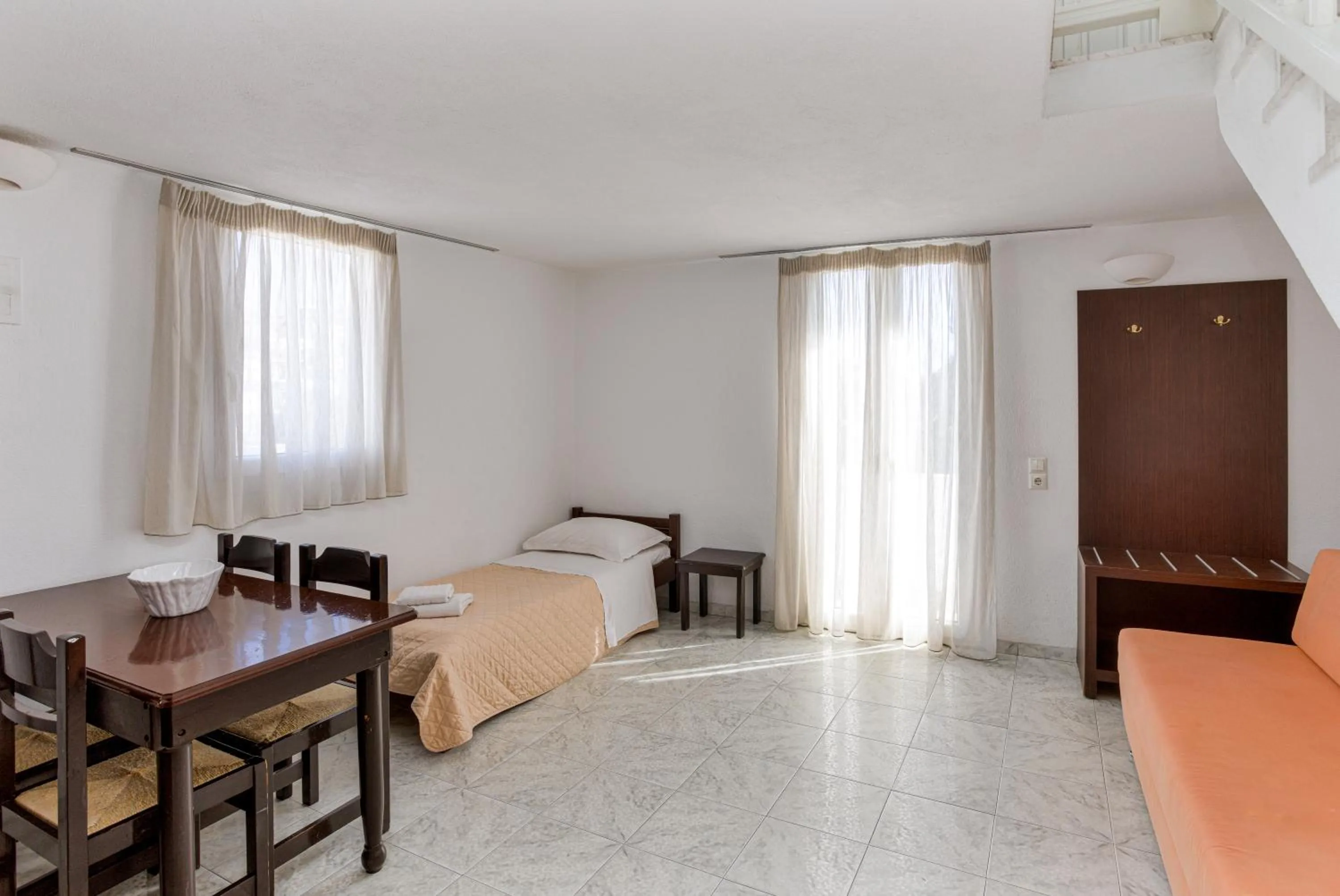 Bed in Elena Studios & Suites