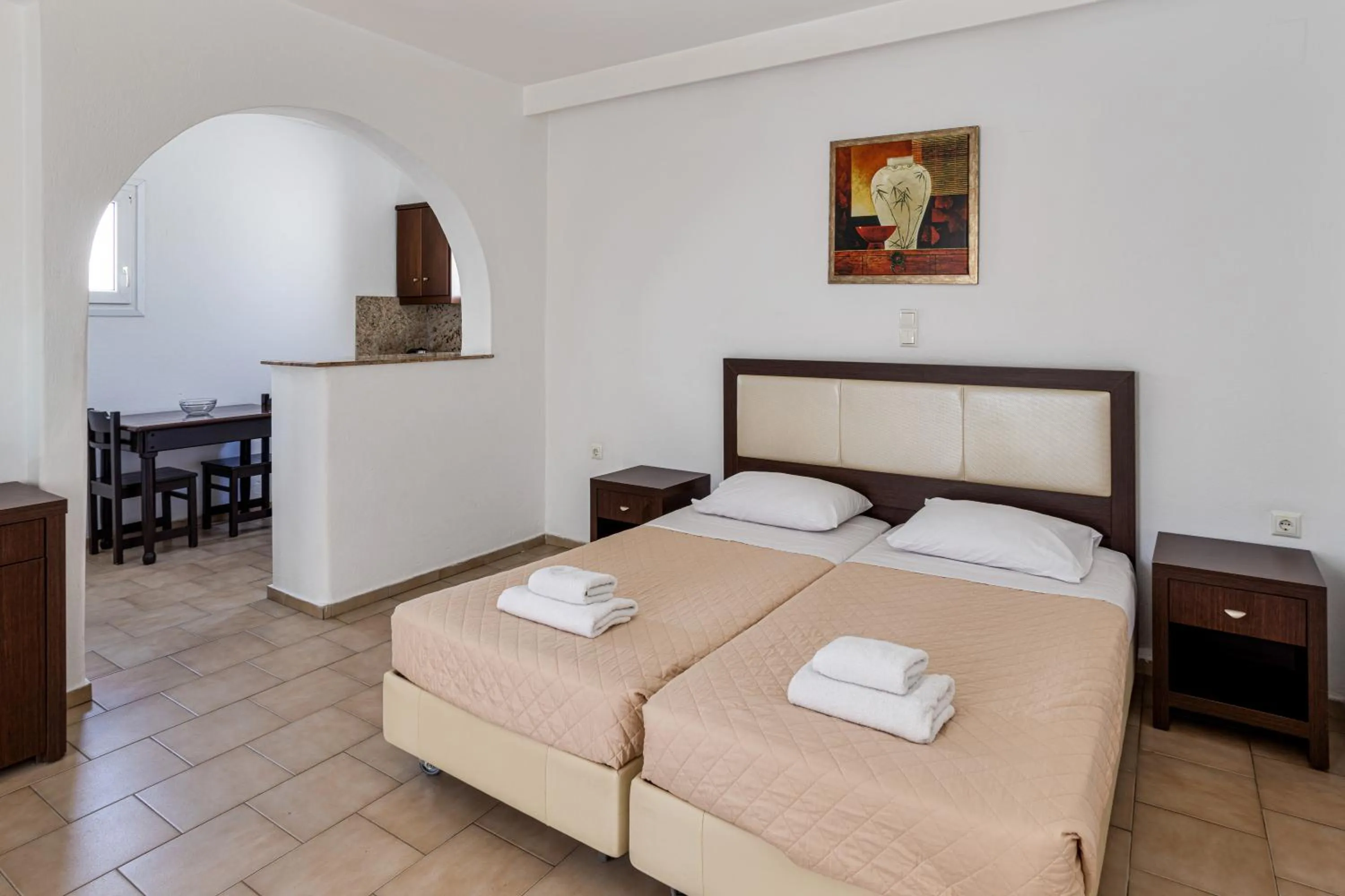 Bed in Elena Studios & Suites