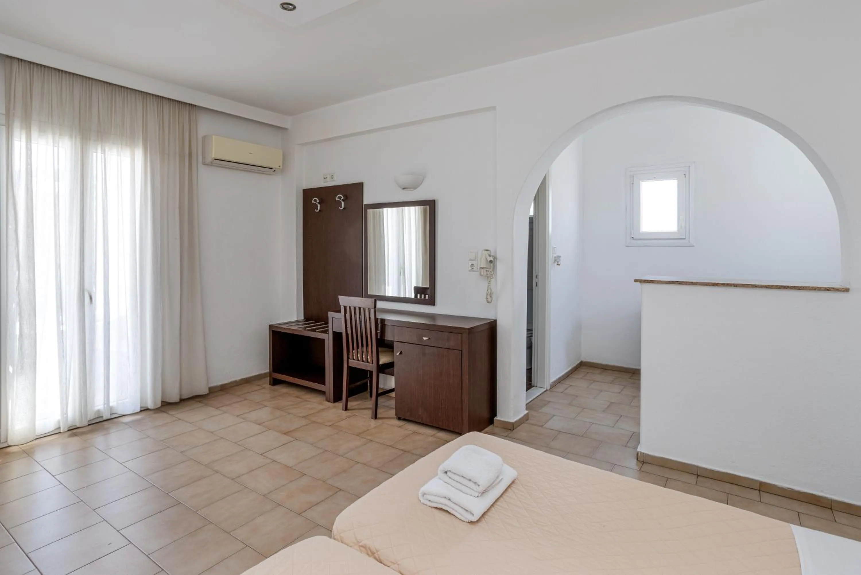 Bed in Elena Studios & Suites