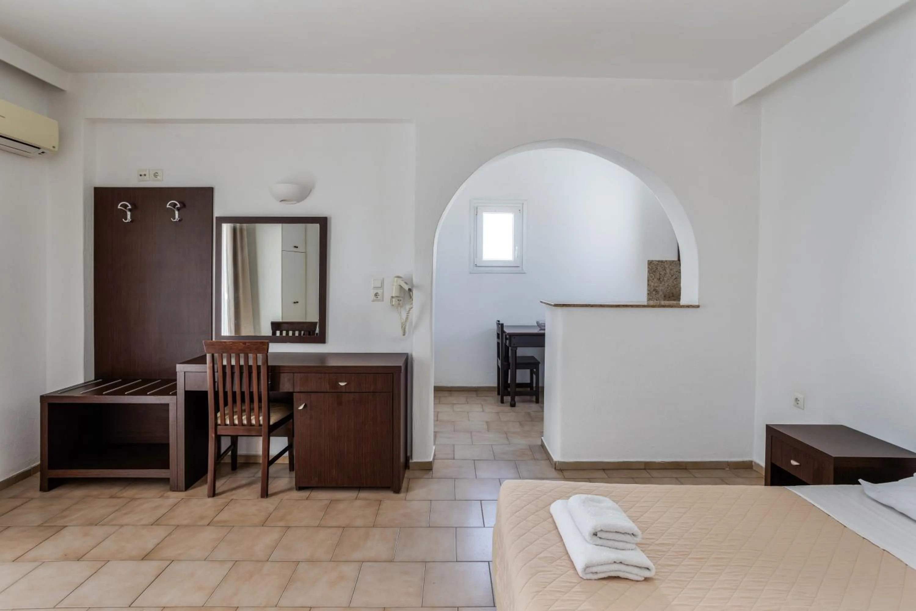 Bed in Elena Studios & Suites