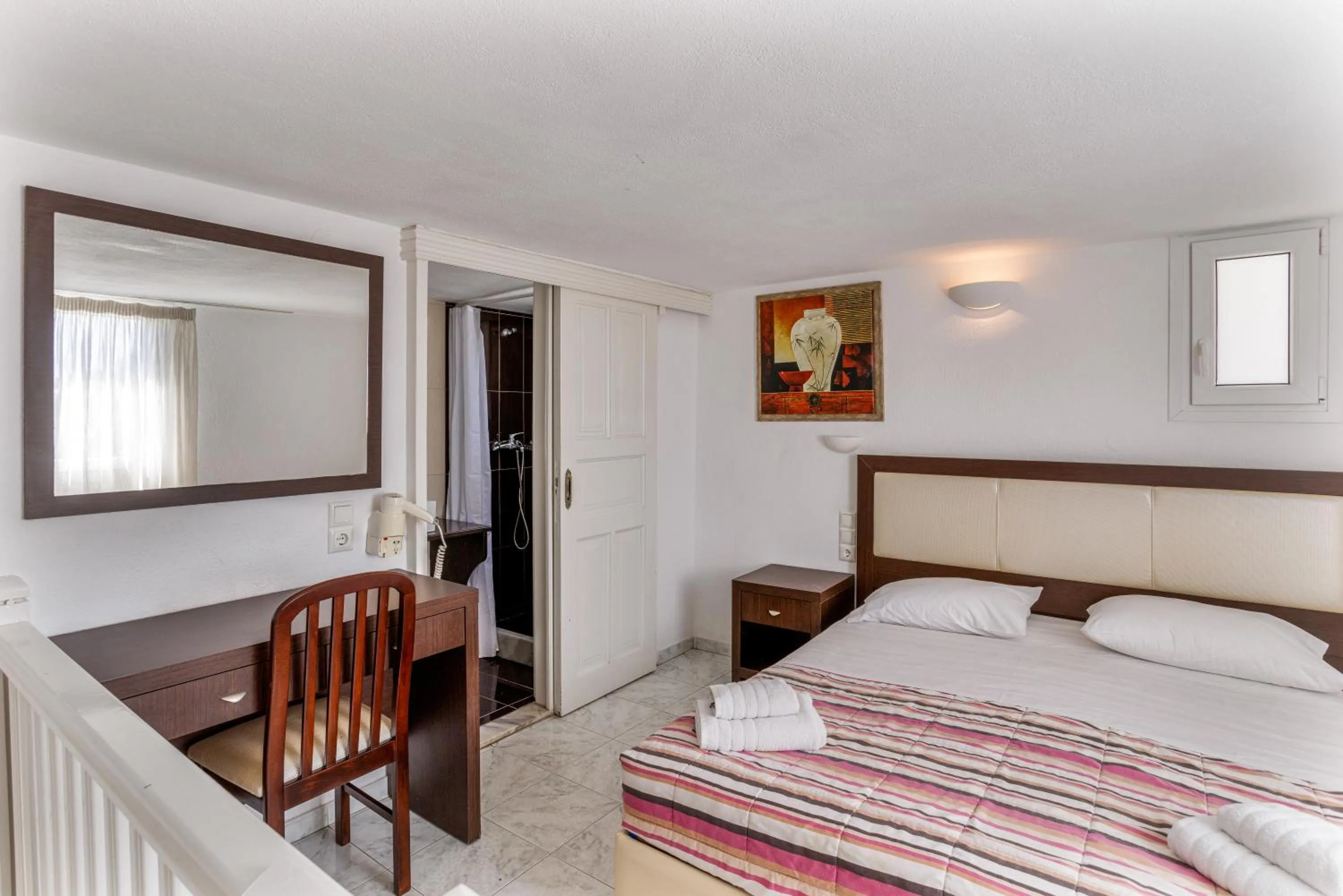 Bed in Elena Studios & Suites