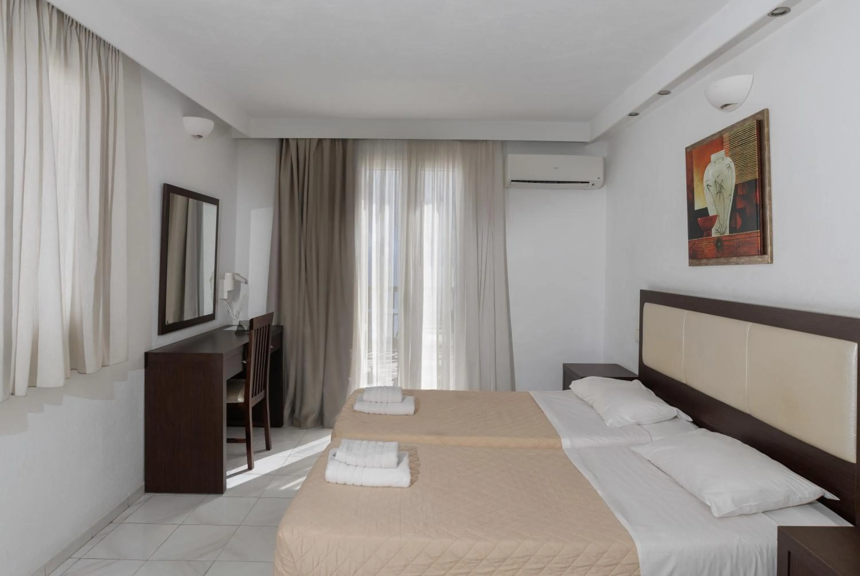 Bed in Elena Studios & Suites