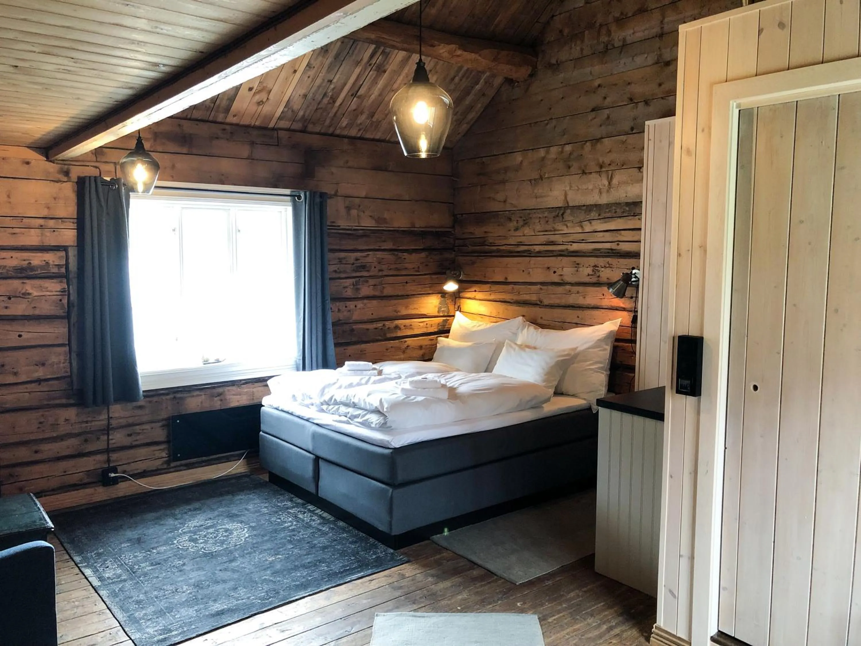 Bed in Reine Rorbuer - by Classic Norway Hotels