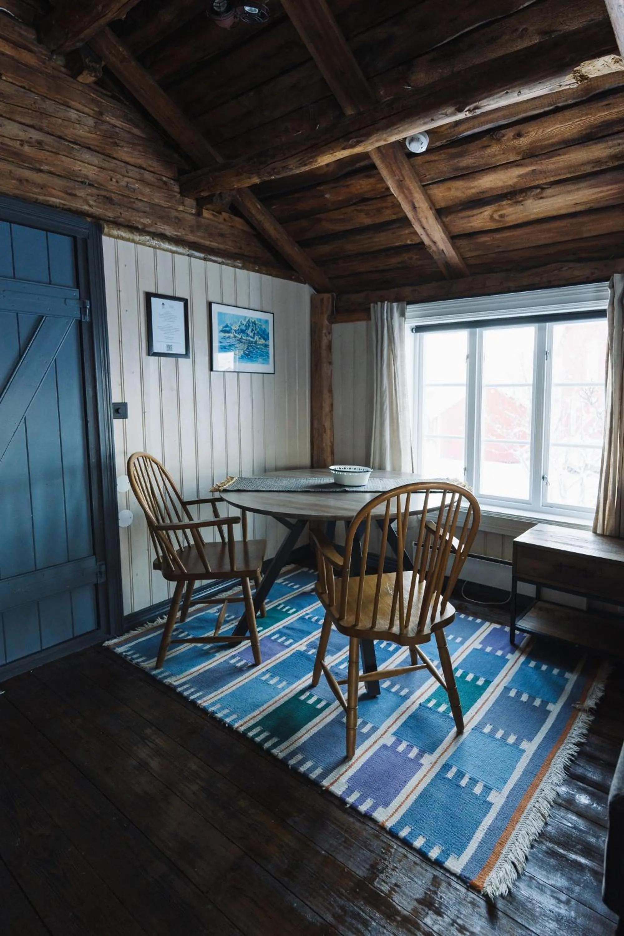 Seating area in Reine Rorbuer - by Classic Norway Hotels