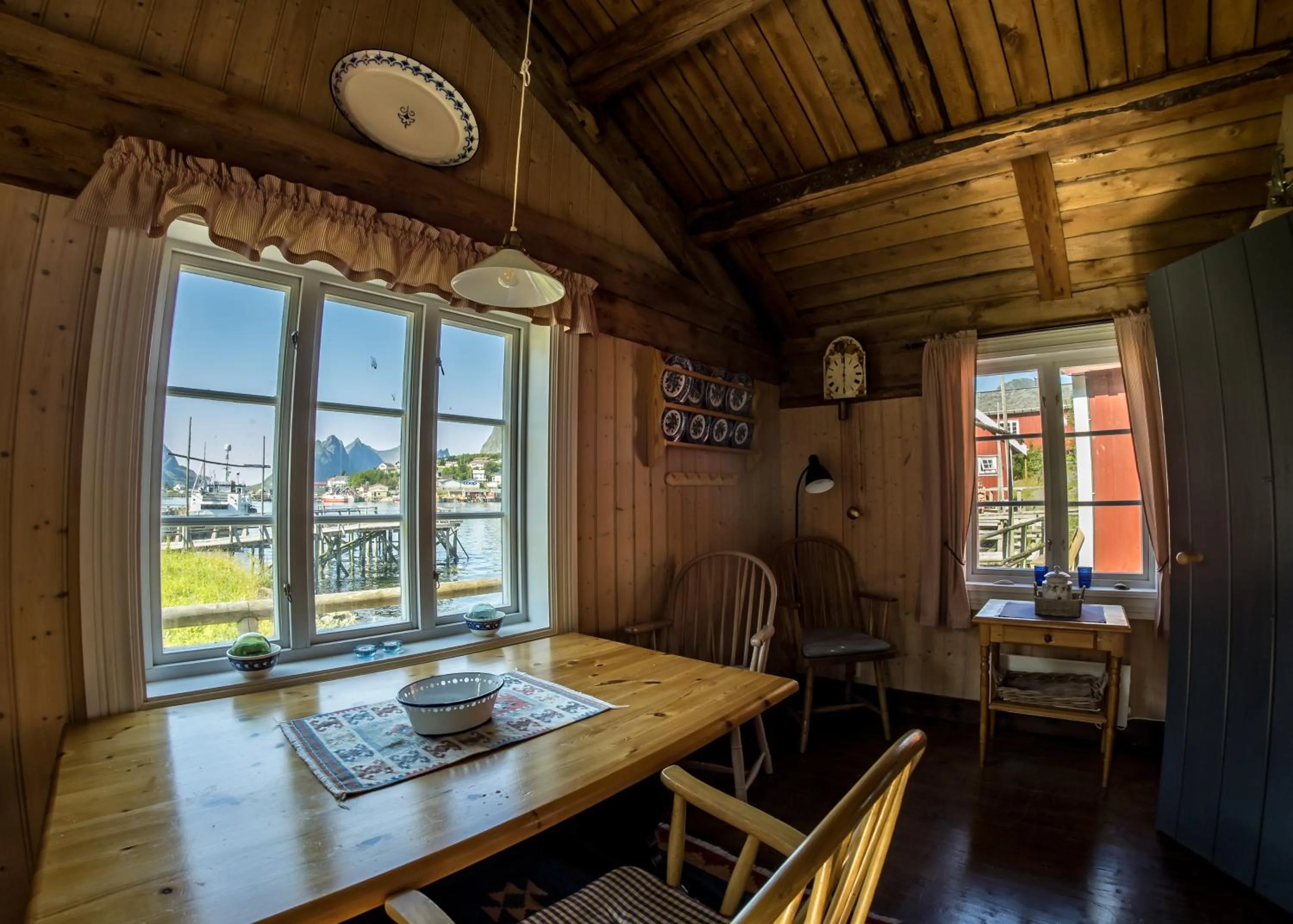 Dining area in Reine Rorbuer - by Classic Norway Hotels