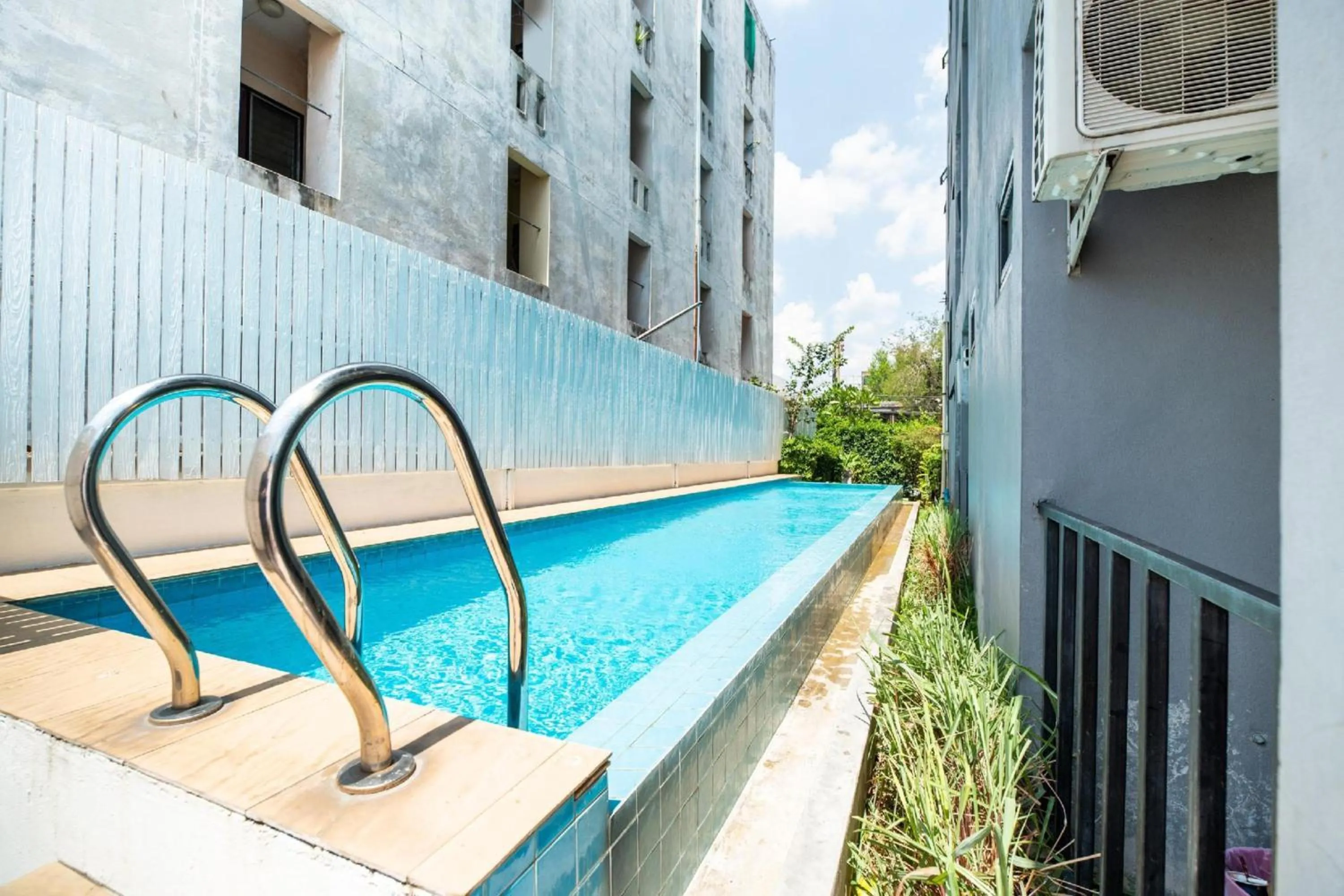 Swimming pool in Super OYO 427 Chill Apartment