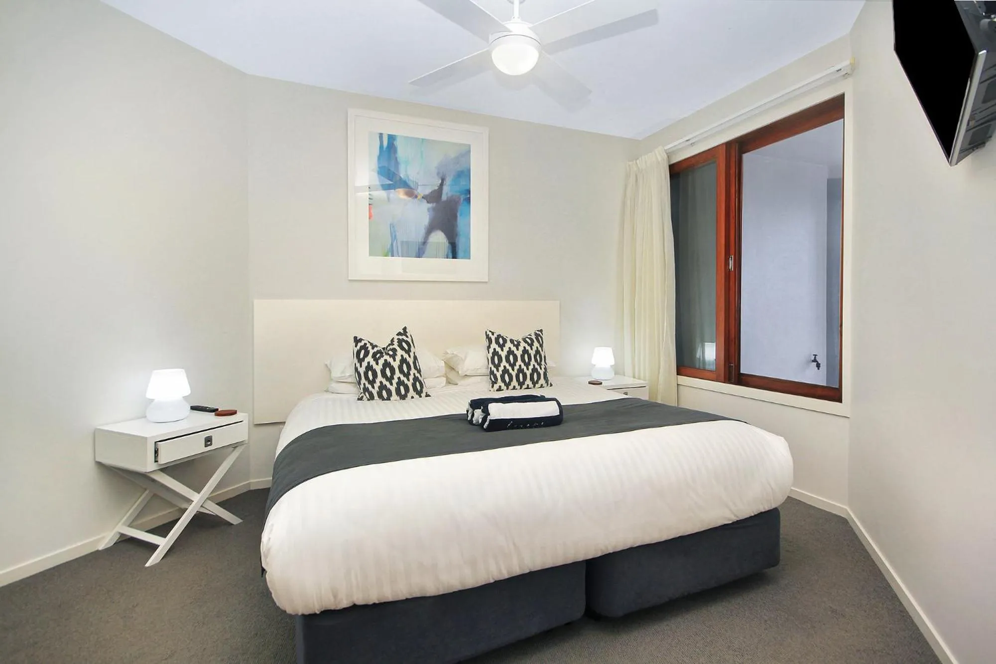 Bed in Lennox Holiday Apartments