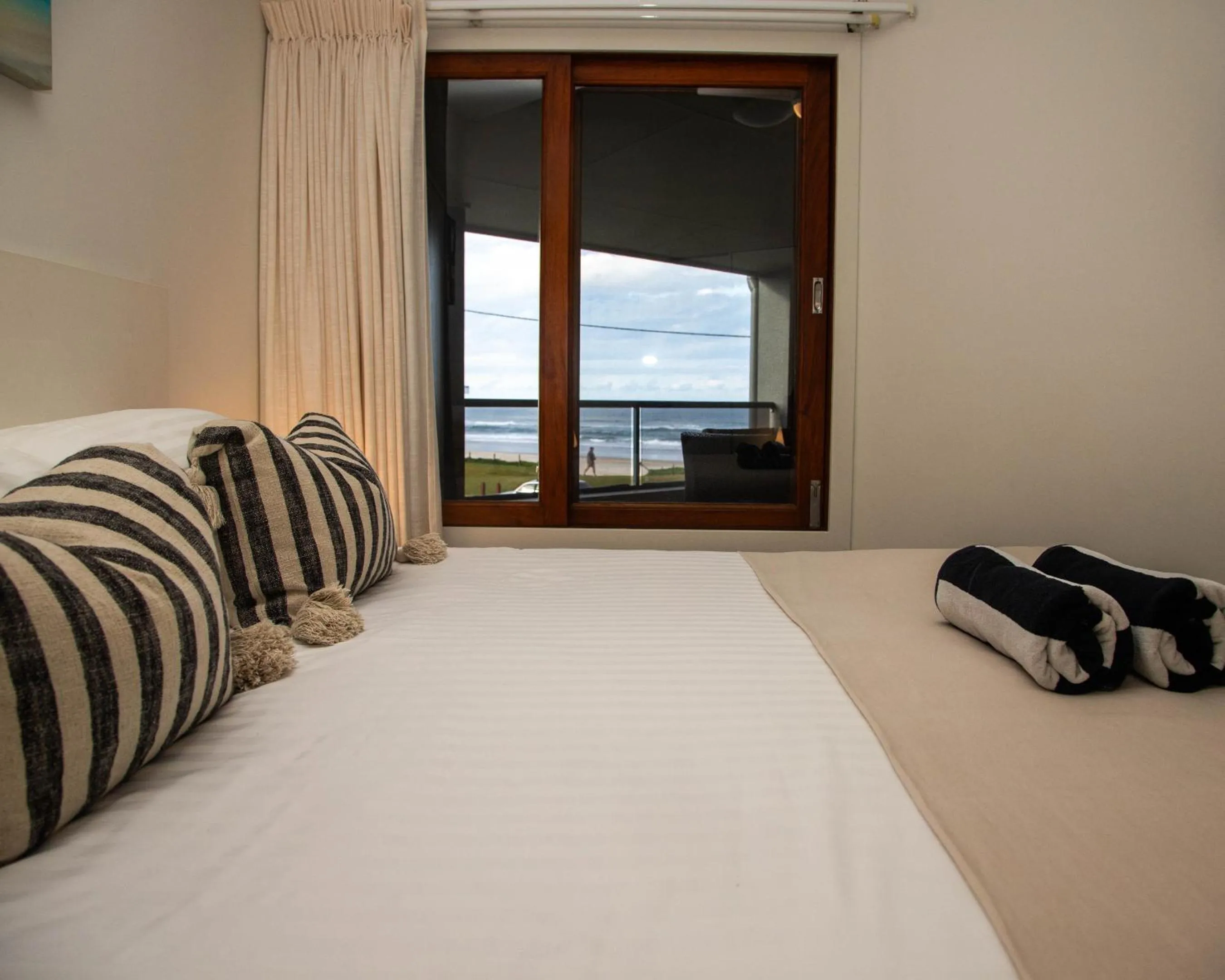 Bed in Lennox Holiday Apartments