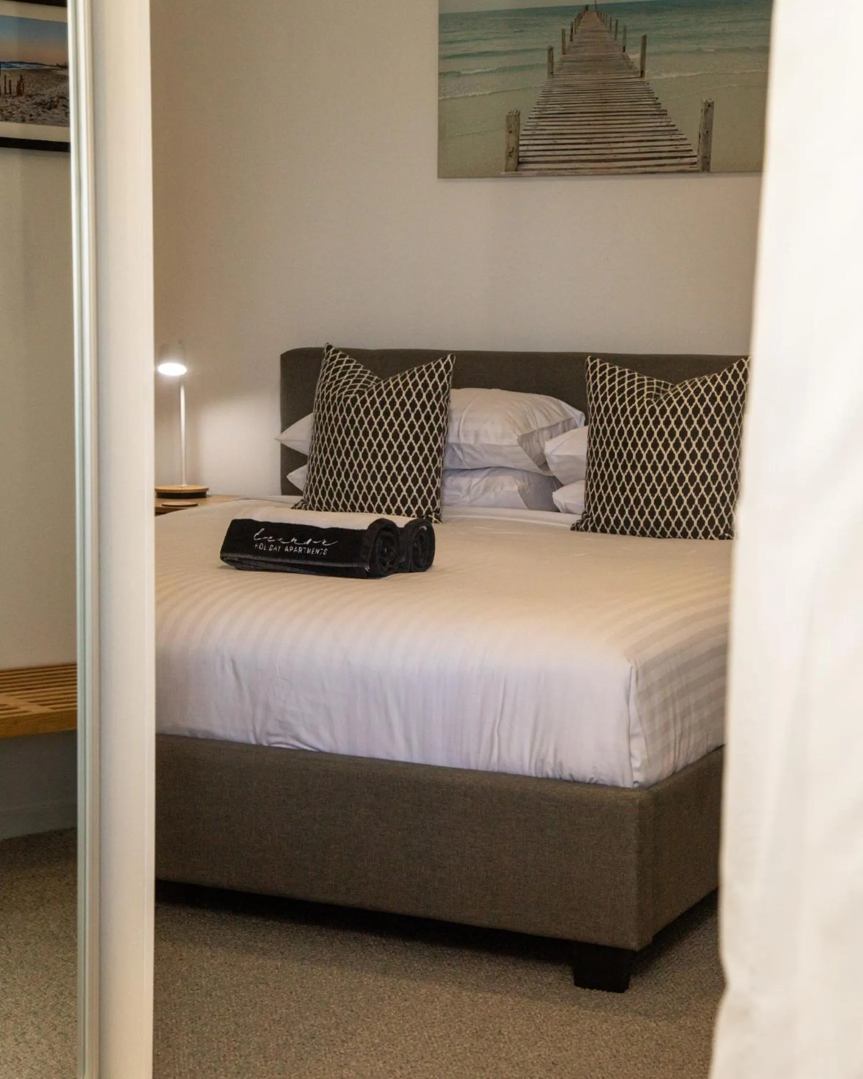 Bed in Lennox Holiday Apartments