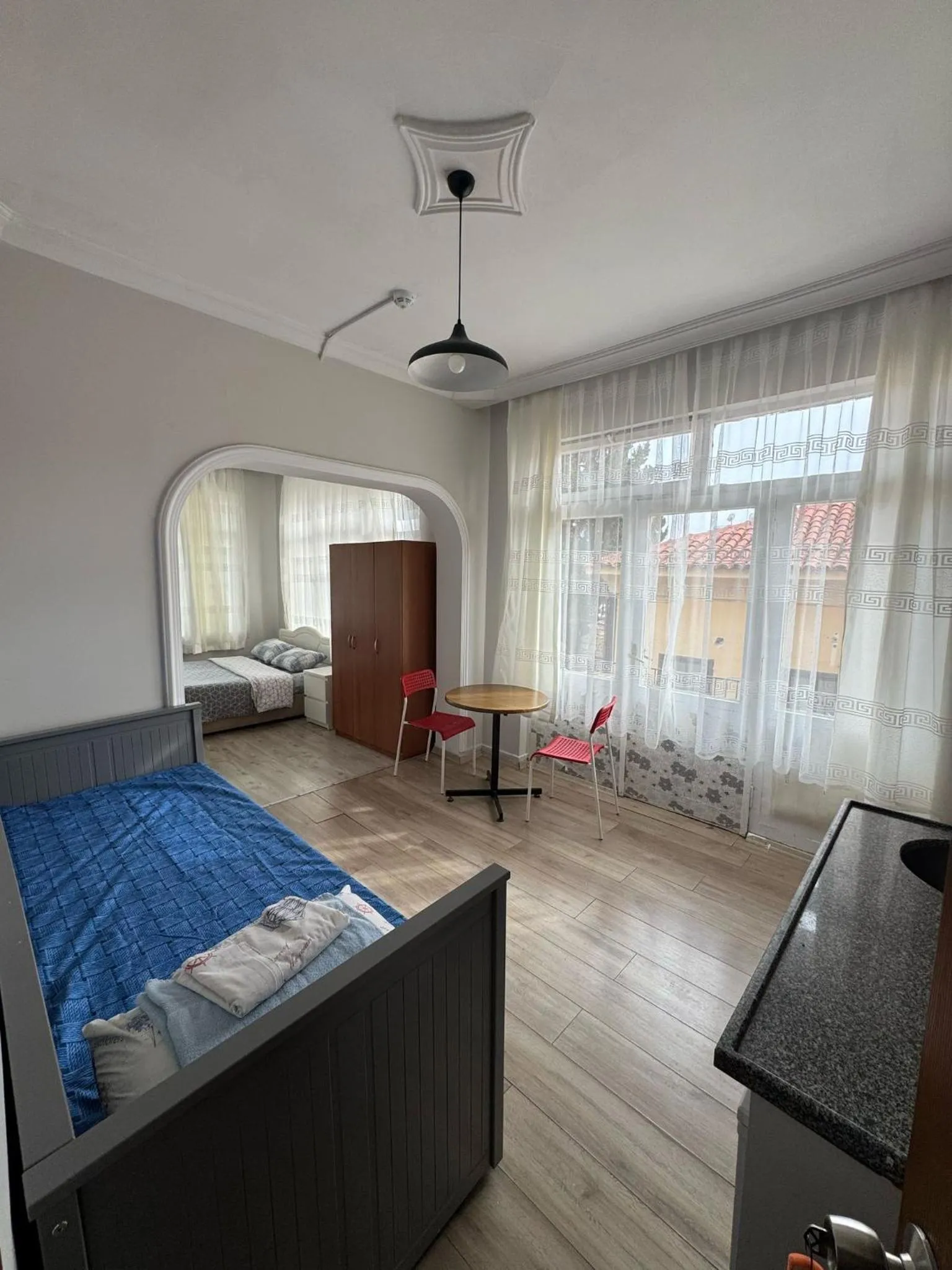 Seating area, Bed in Erkal Pension