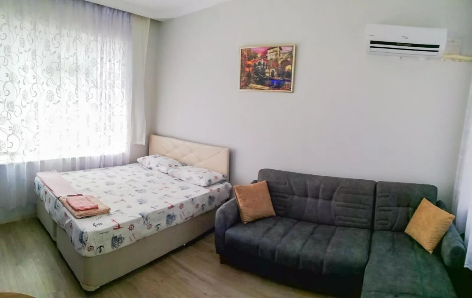 Seating area, Bed in Erkal Pension