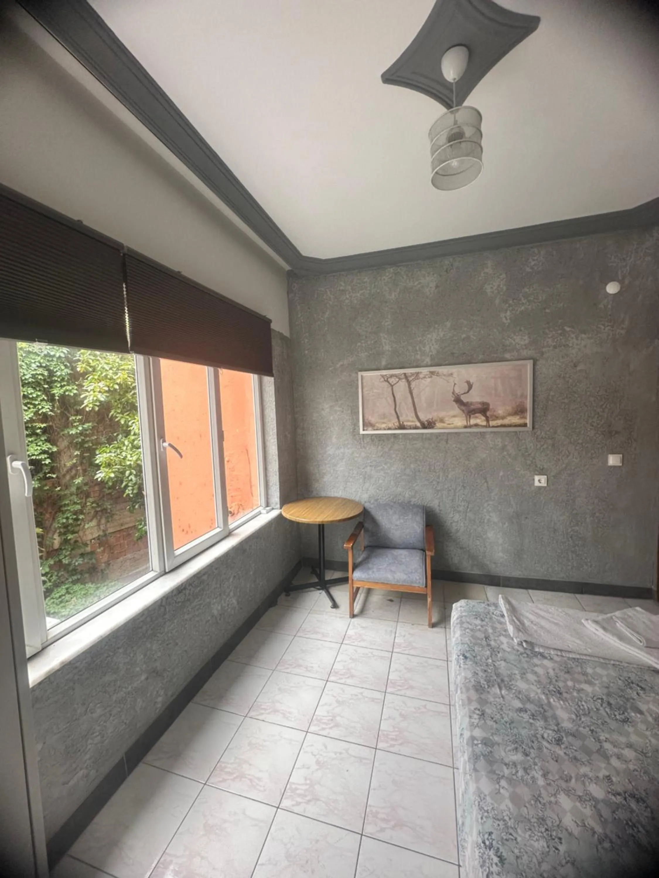 Seating area, Bed in Erkal Pension