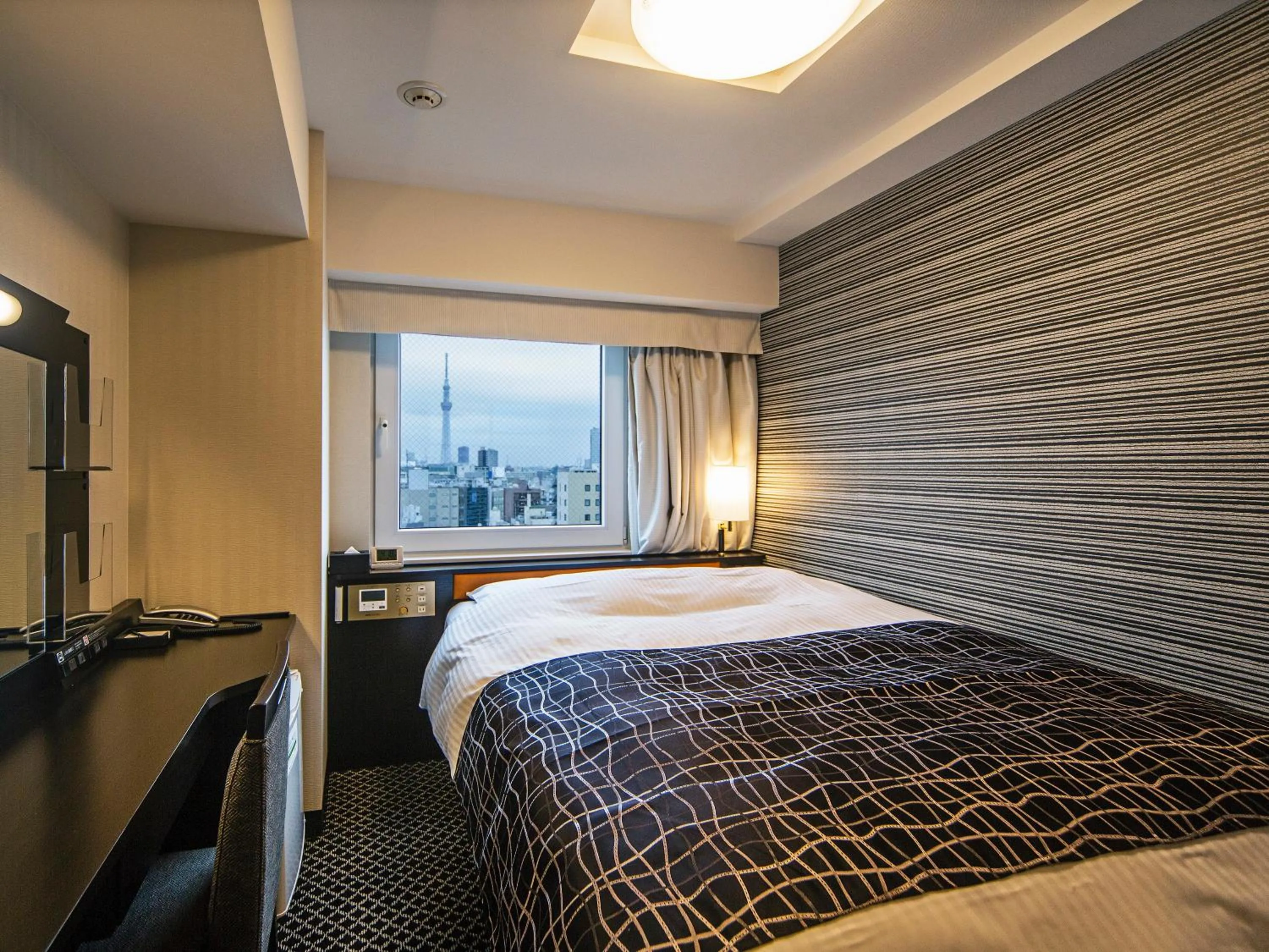 Bed in APA Hotel Nihombashi Bakurocho Ekikita