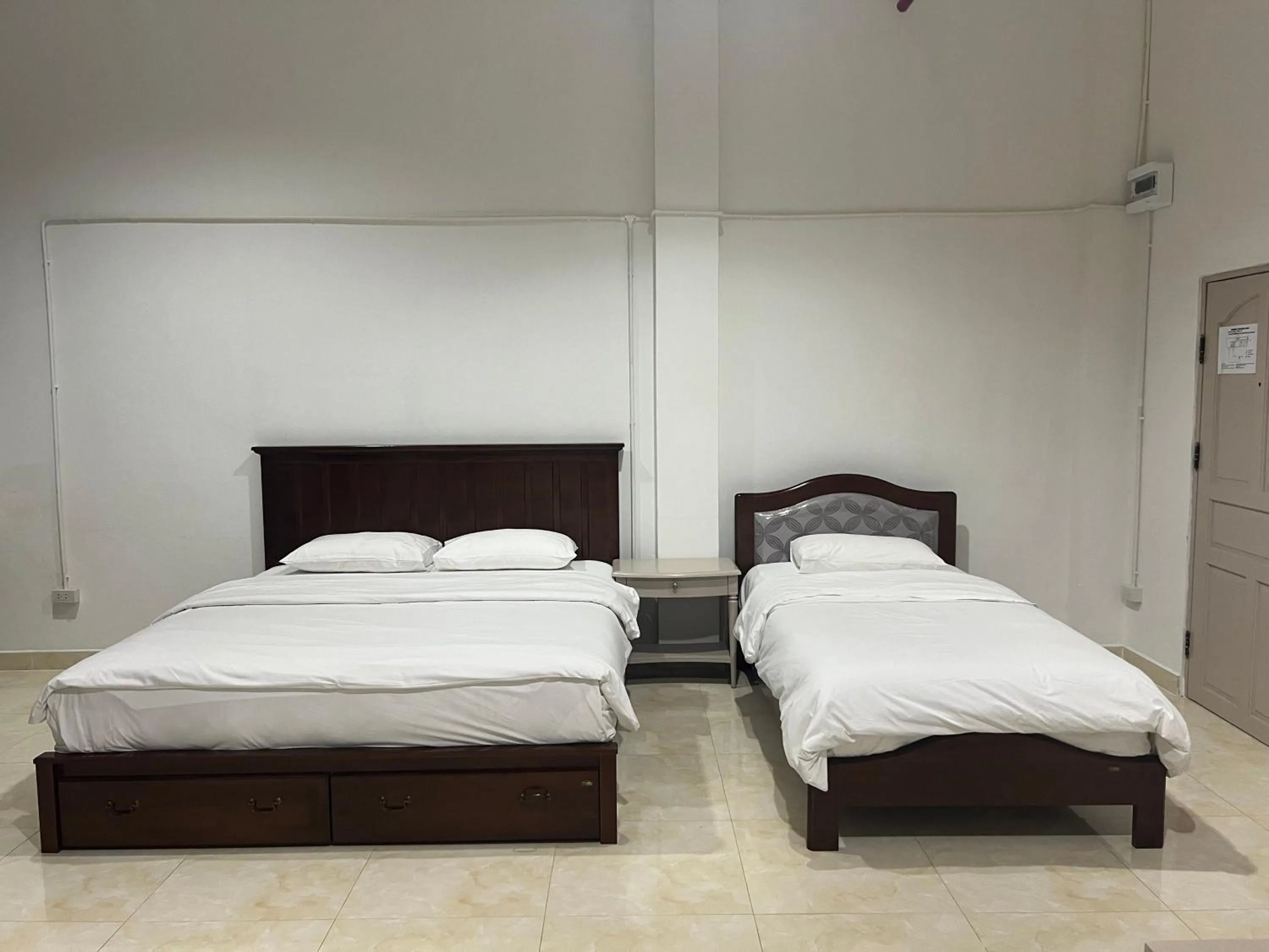 Bed in Mall Suites Hotel