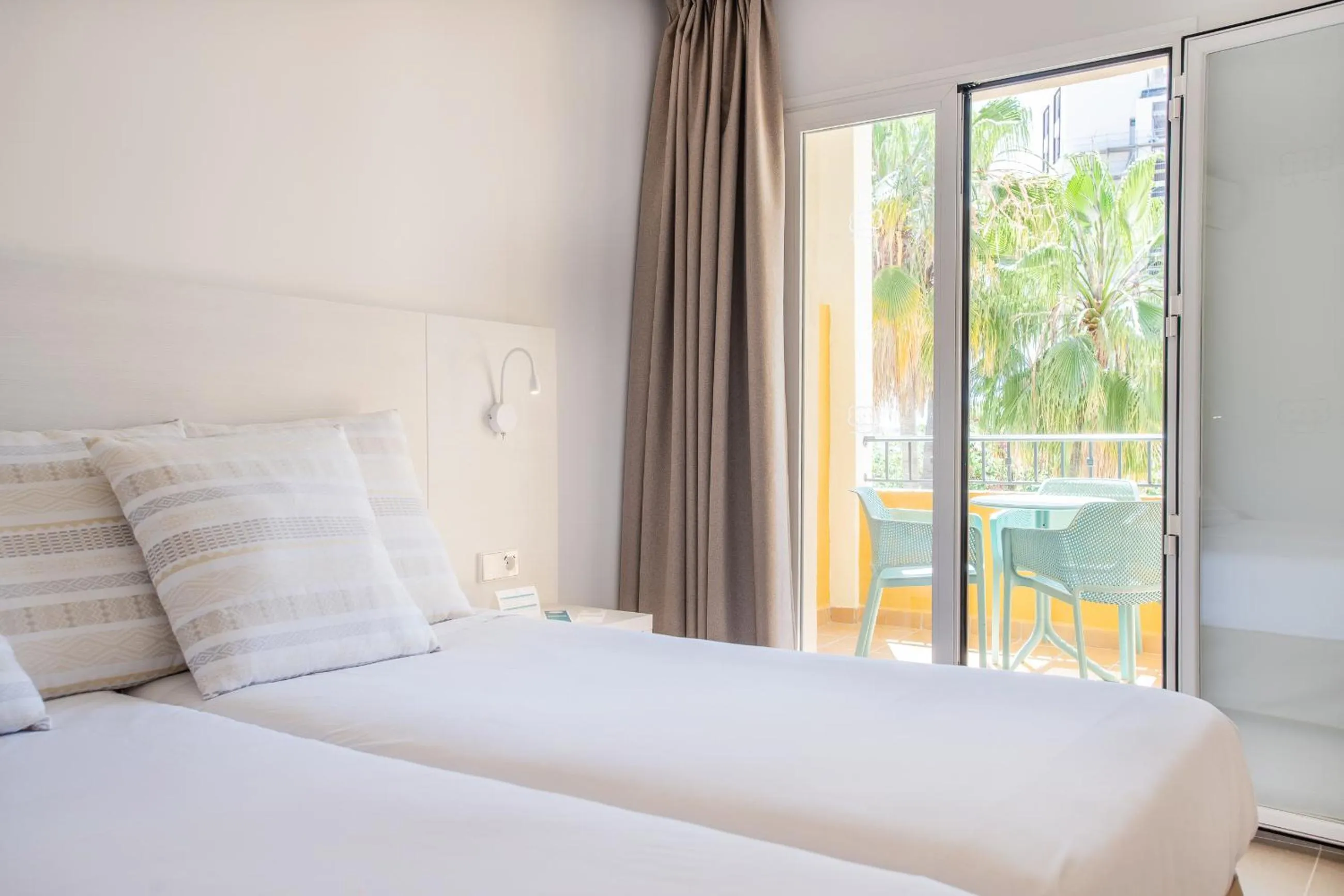 Bed in FLOR los Almendros Hotel