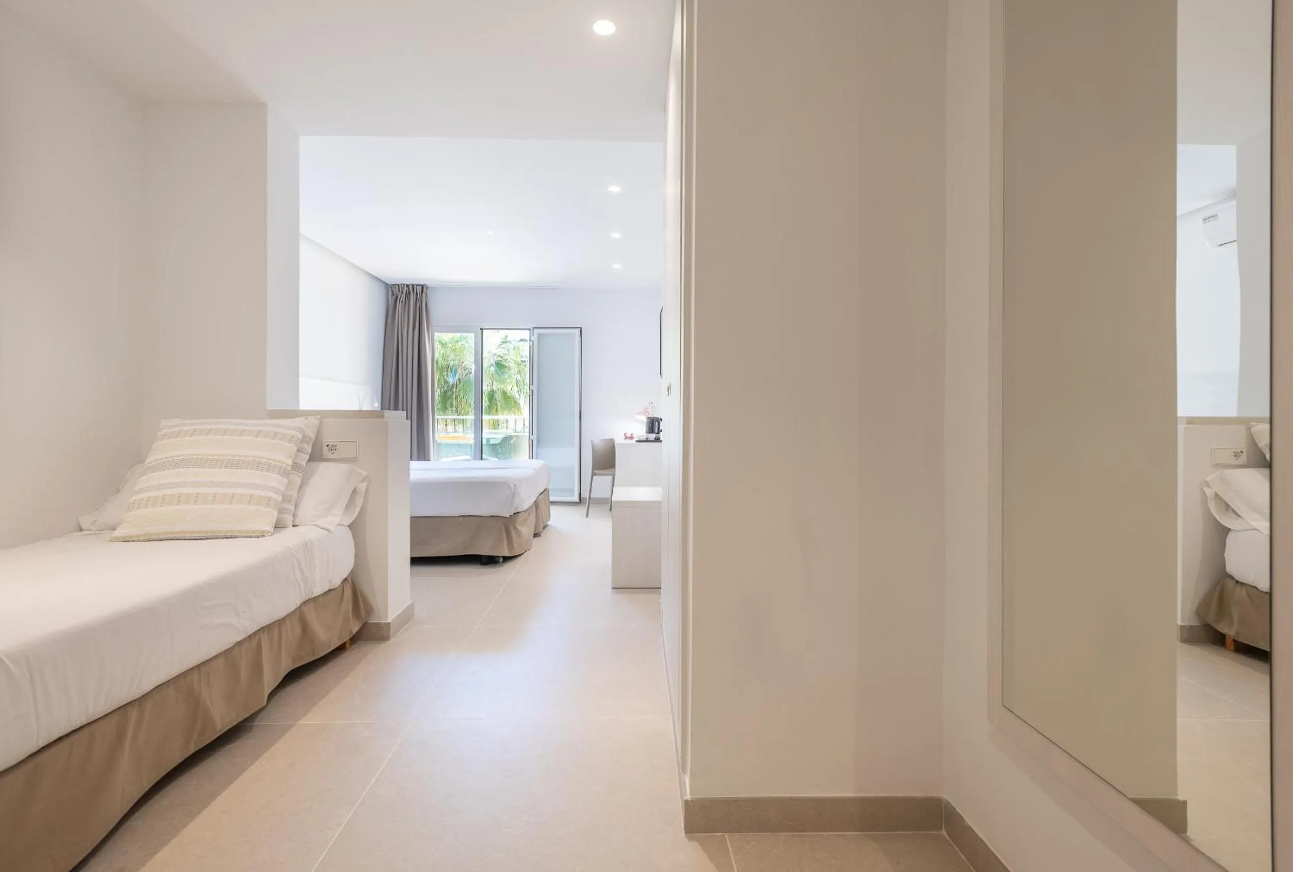 Bed in FLOR los Almendros Hotel