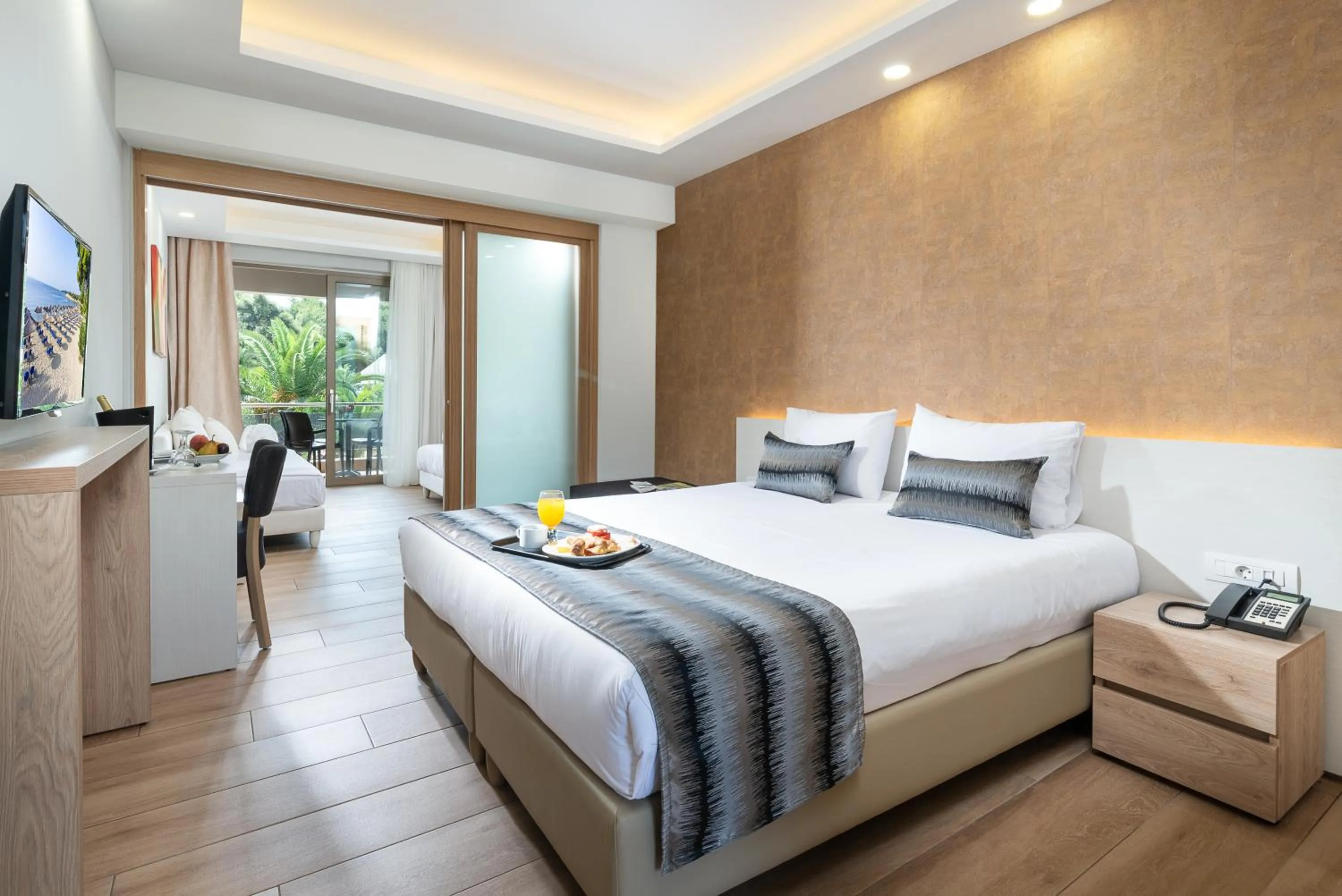 Bed in Poseidon Hotel Sea Resort