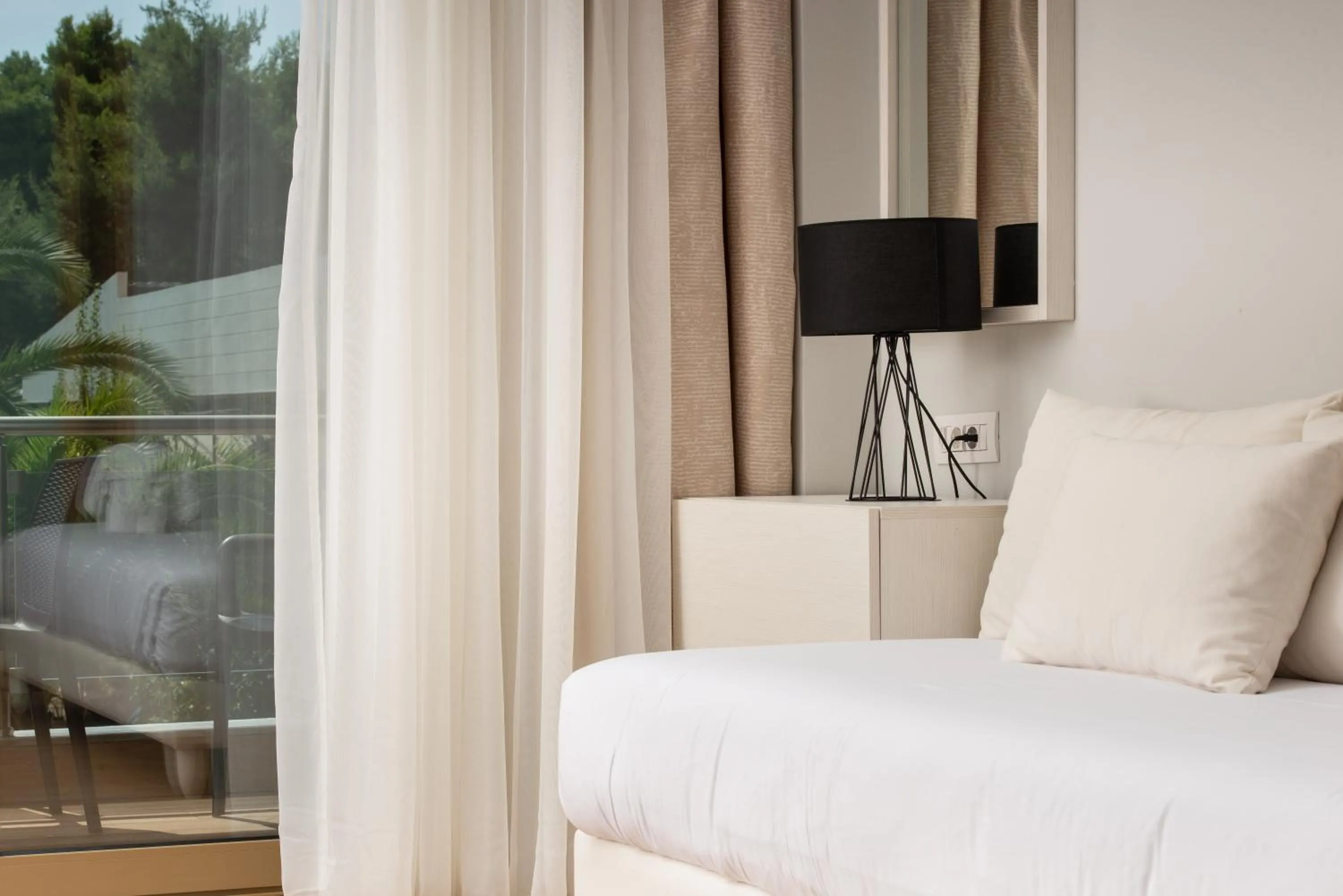 Bed in Poseidon Hotel Sea Resort