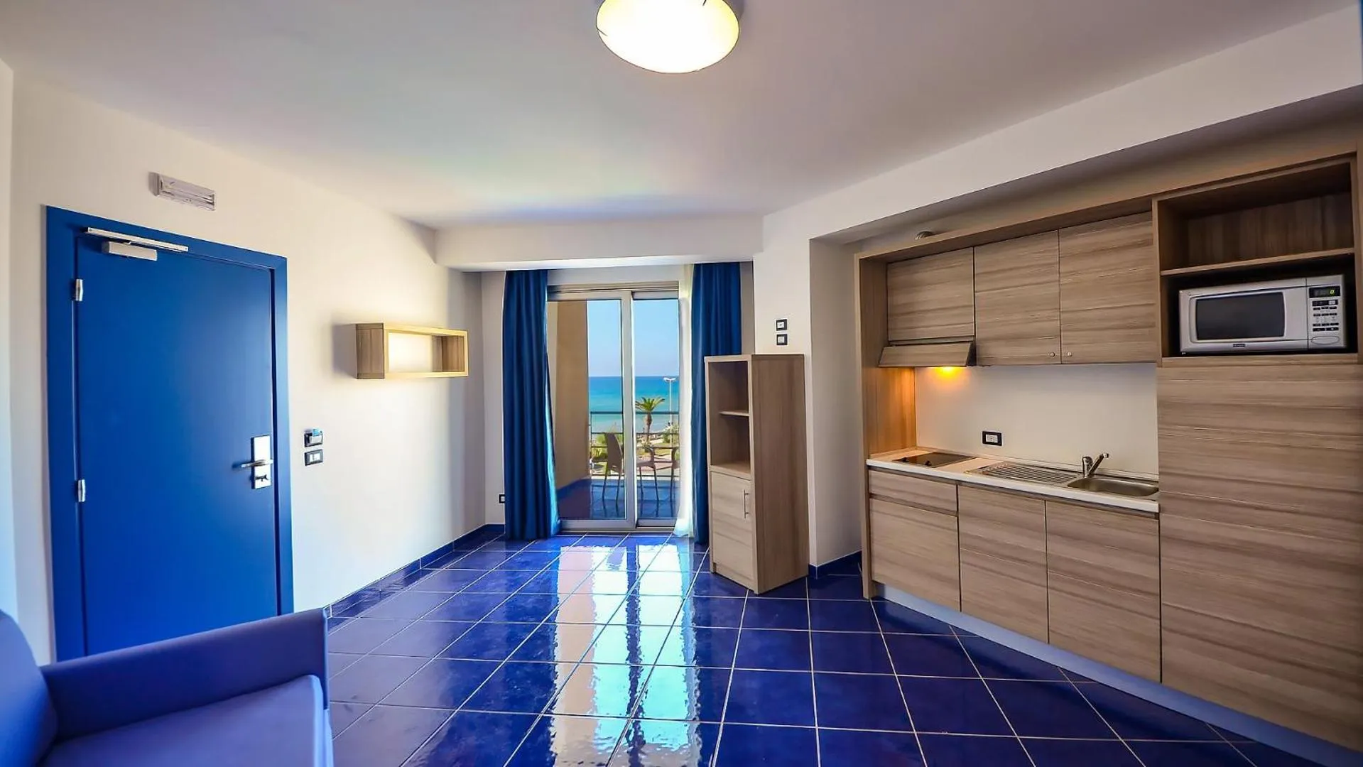 Kitchen or kitchenette in Astro Suite Hotel