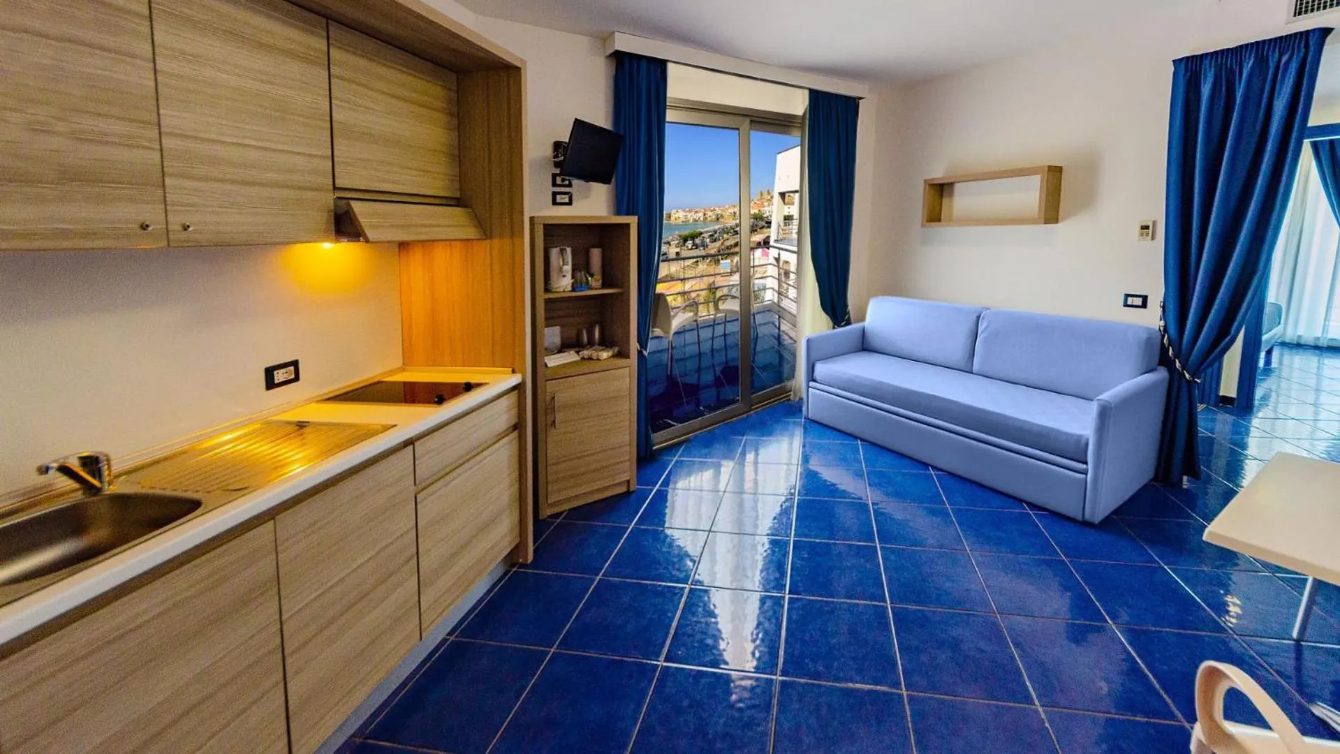 Kitchen or kitchenette, Bed in Astro Suite Hotel