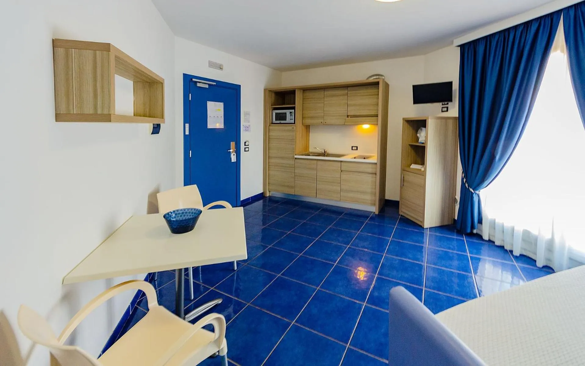 Kitchen or kitchenette in Astro Suite Hotel
