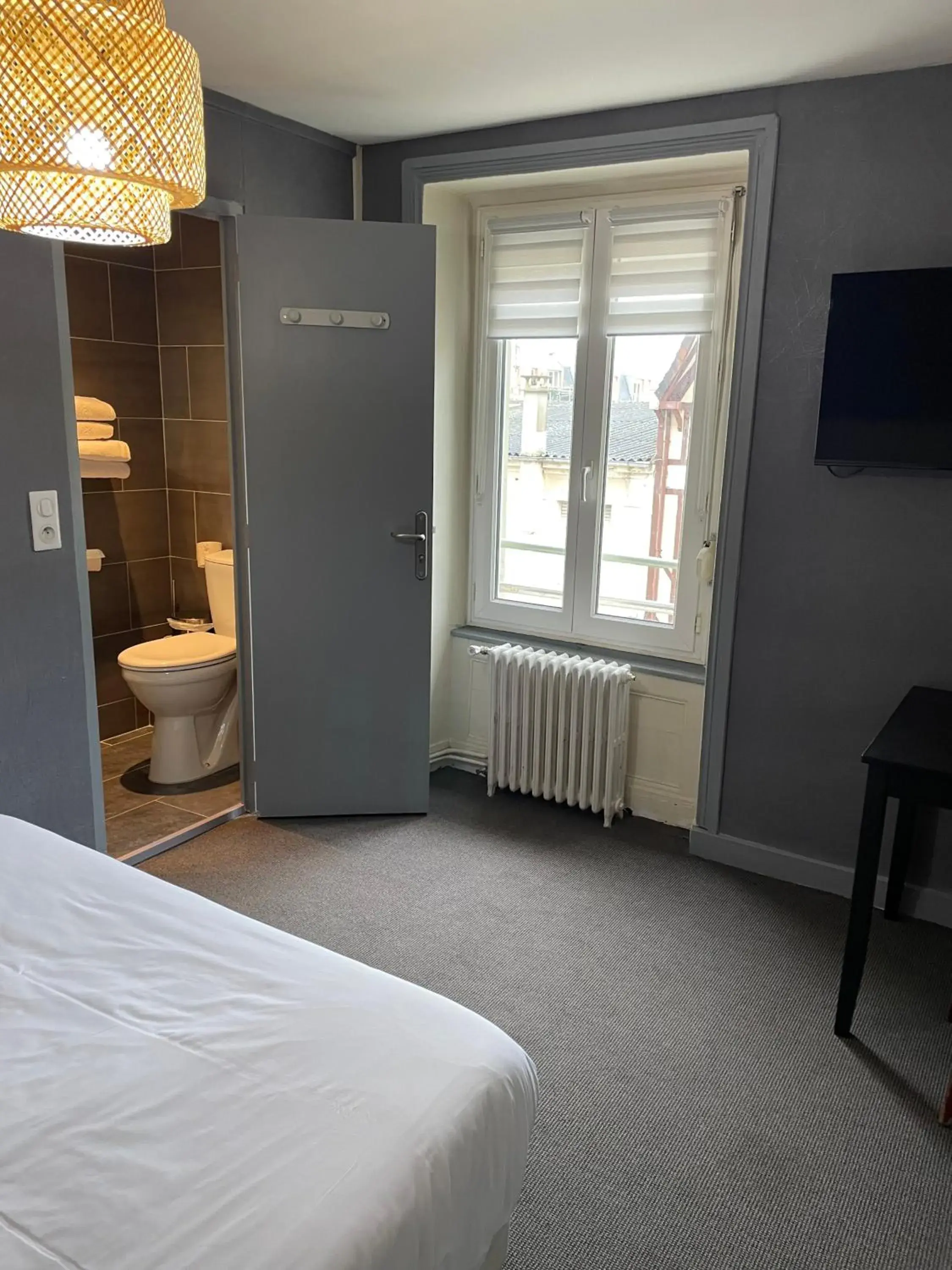 Bed in Beau Rivage Hôtel-Restaurant Bed in Beau Rivage Hôtel-Restaurant