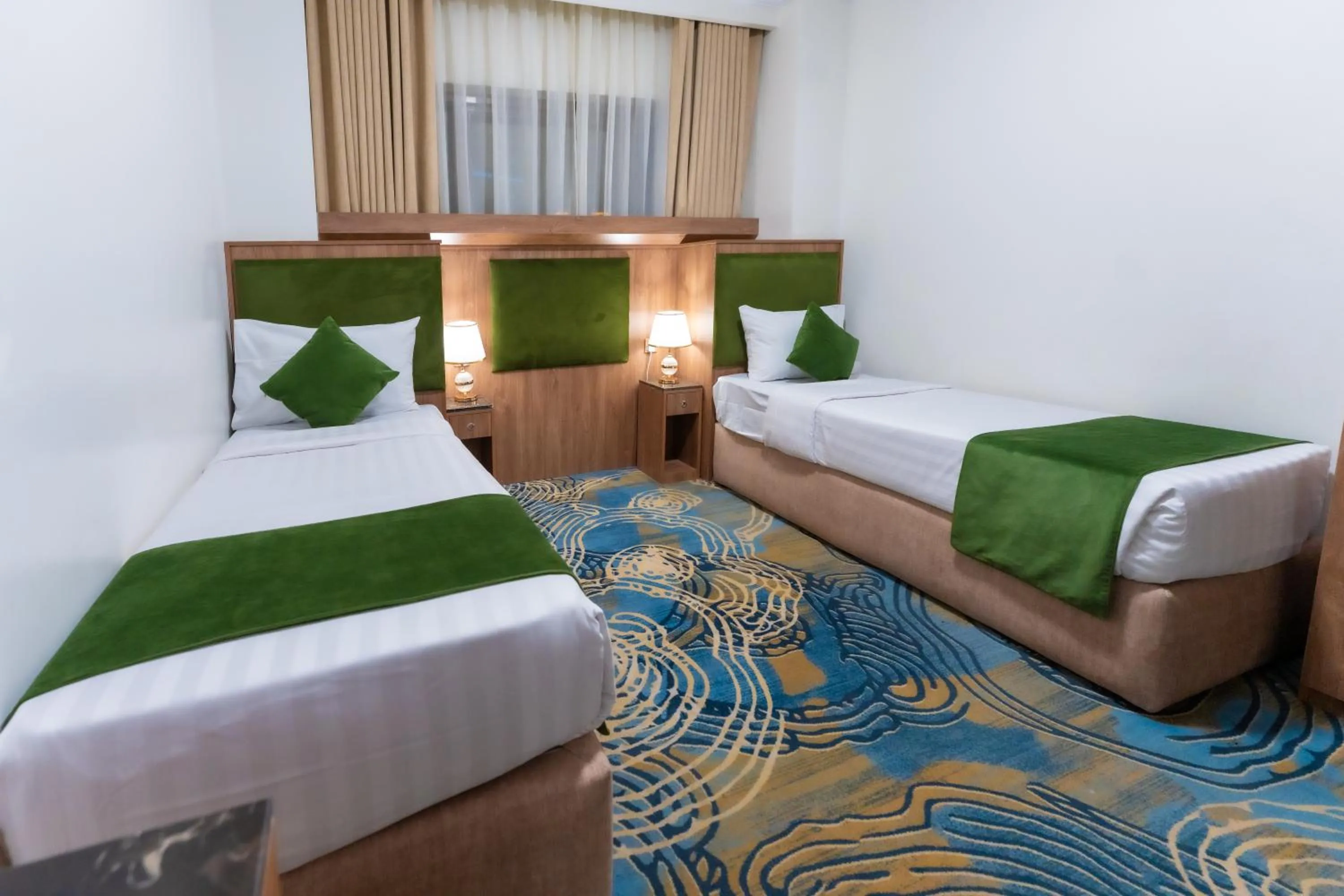 Bed in Hayah Plaza Hotel