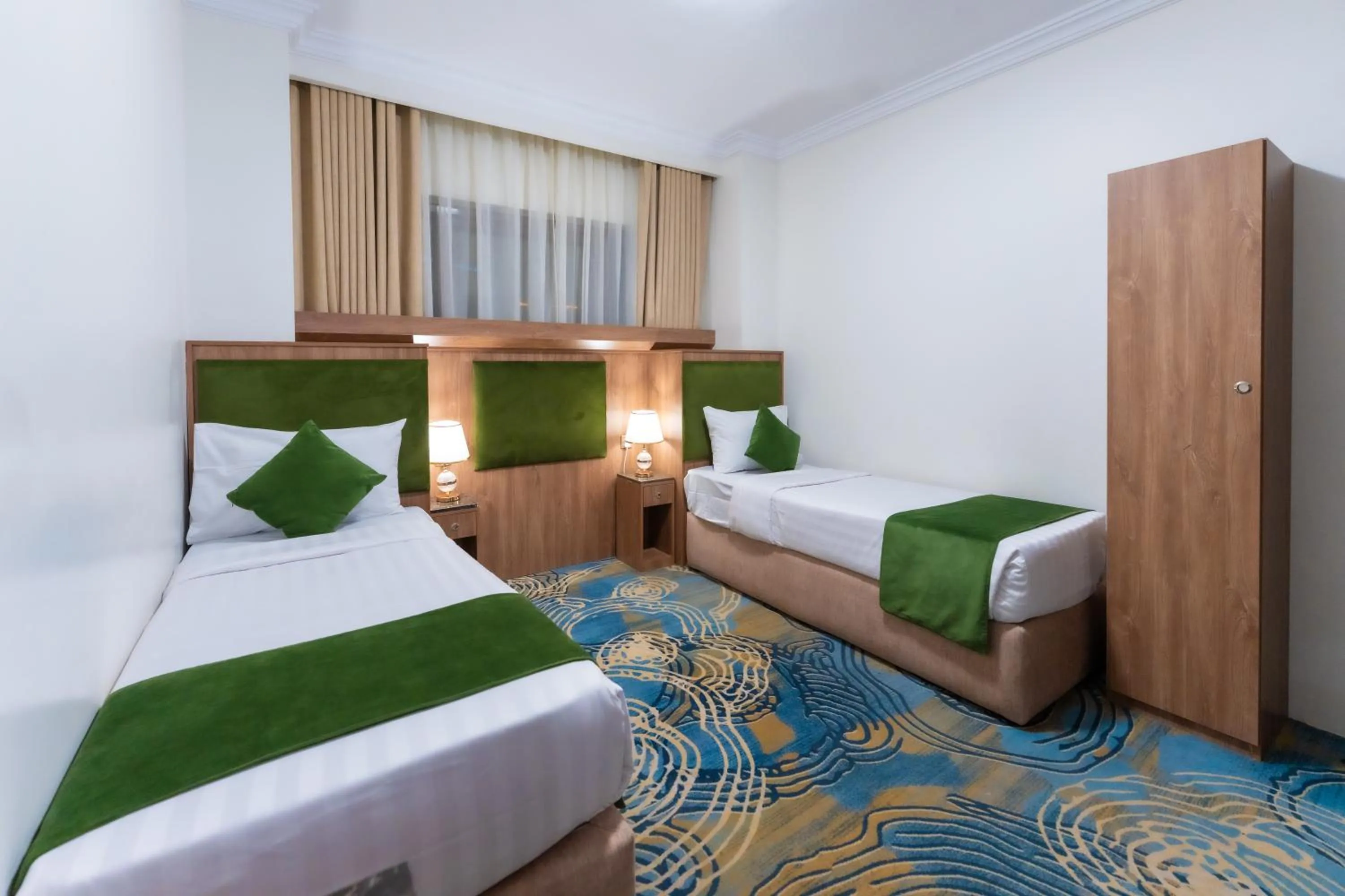 Bed in Hayah Plaza Hotel