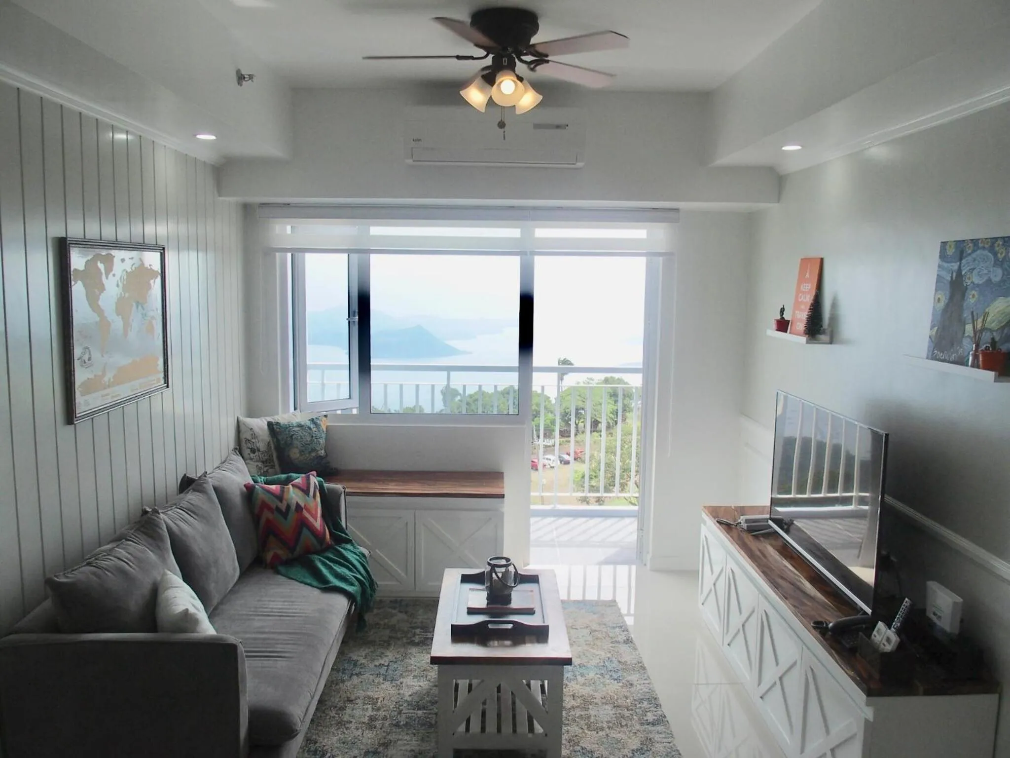Living room in Cozy Family Suite with Stunning View of Taal