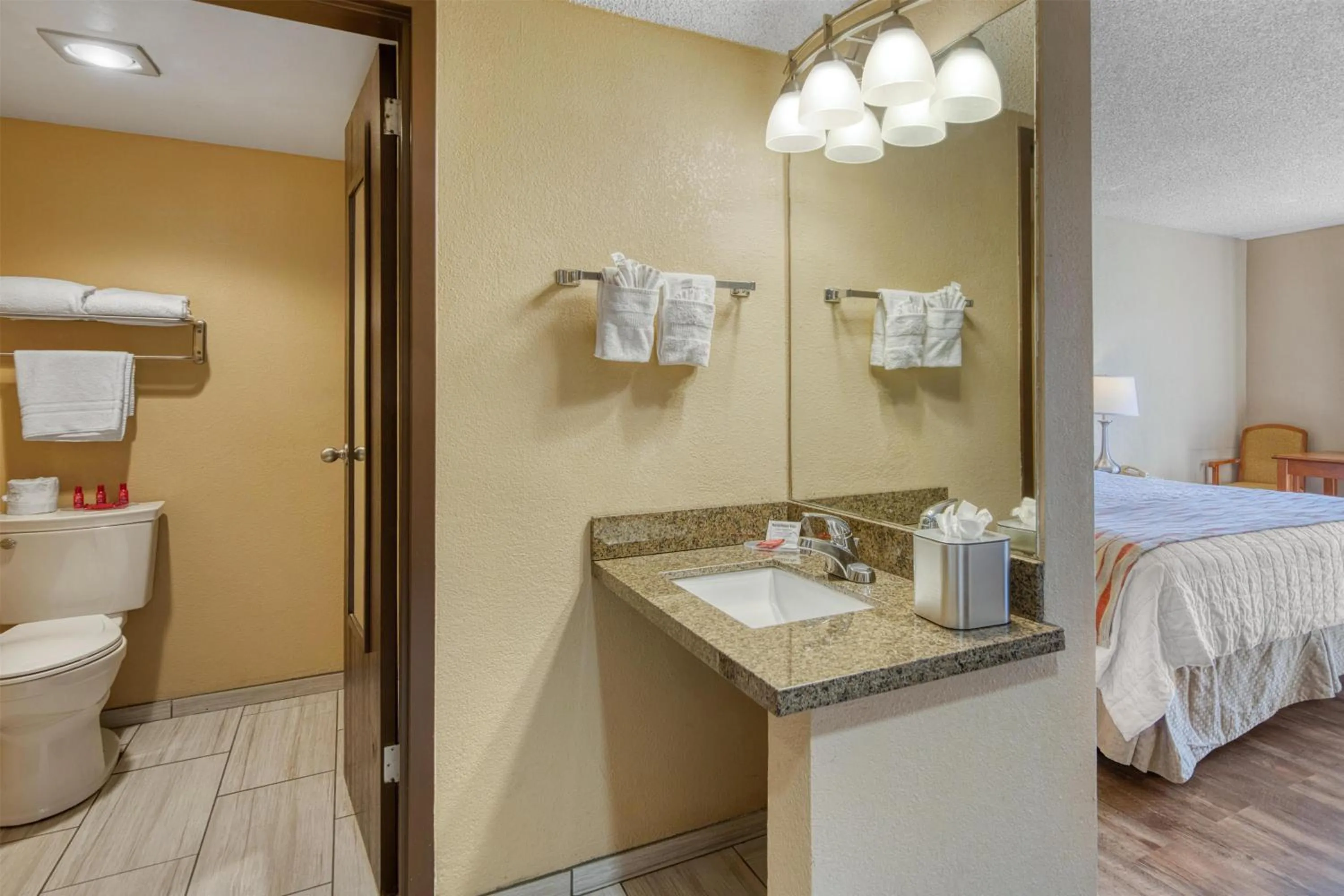 Bathroom, Bed in SureStay Plus Hotel by Best Western Reno Airport