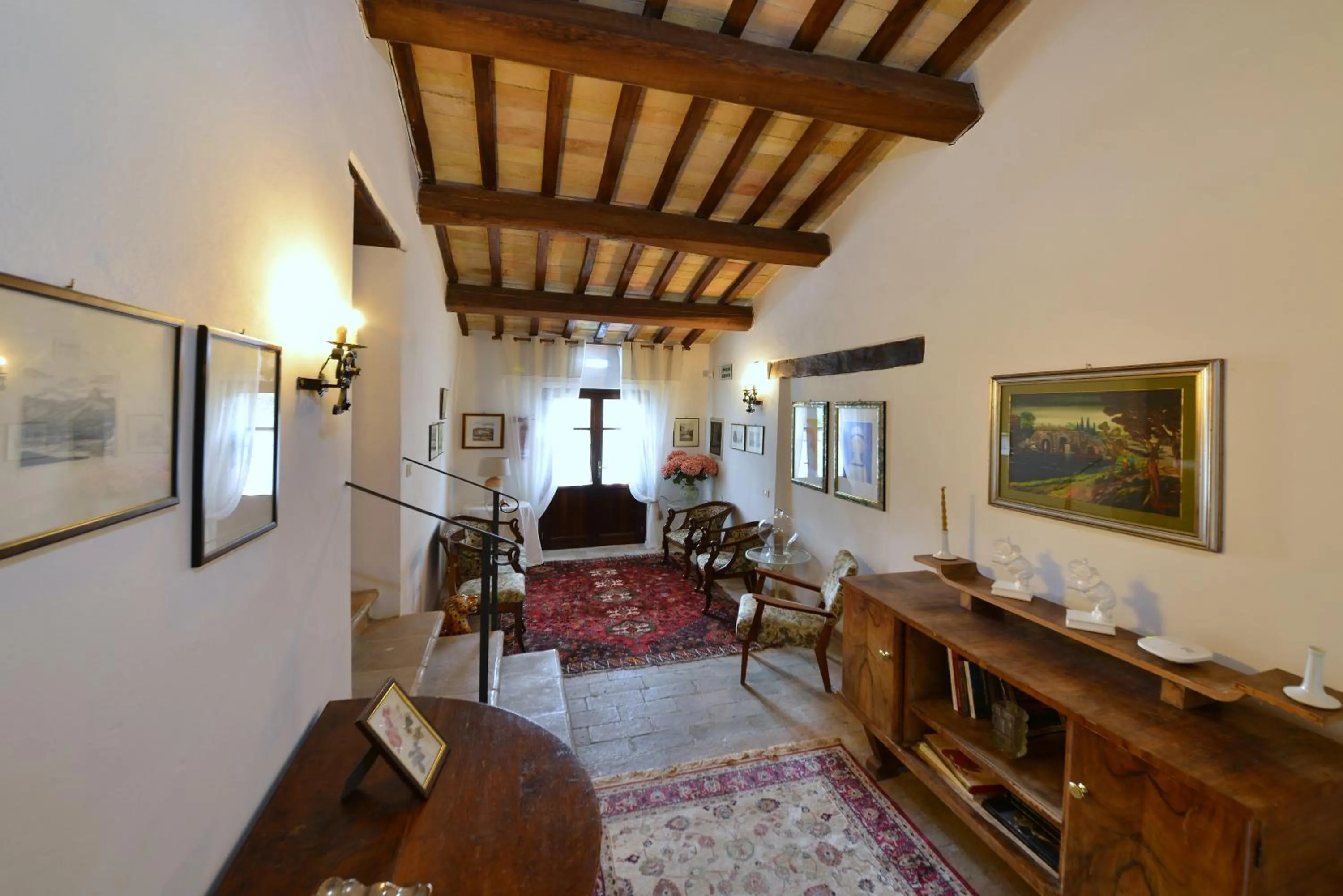 Communal lounge/ TV room in Agriturismo Sasso Rosso