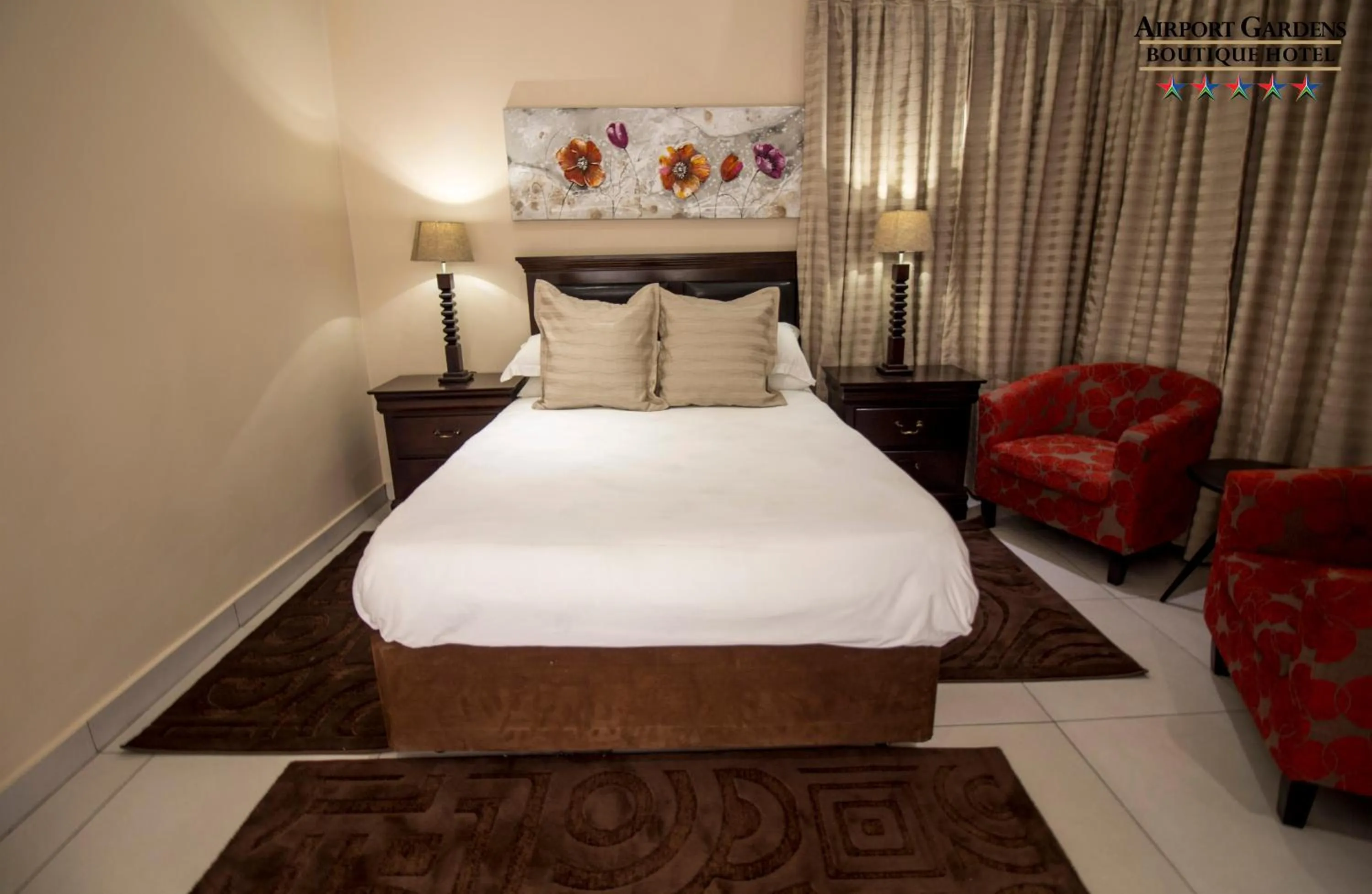 Bed in Airport Gardens Boutique Hotel