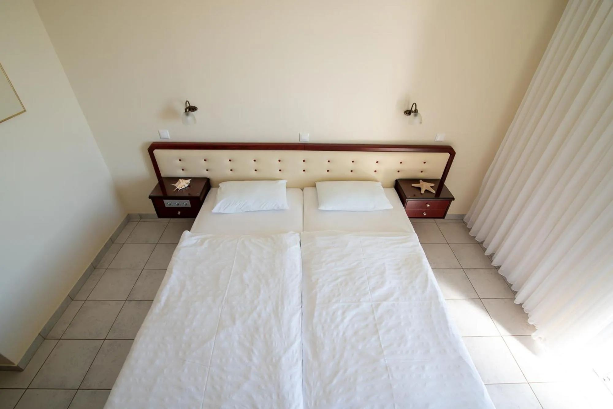 Bed in Dionisos Hotel