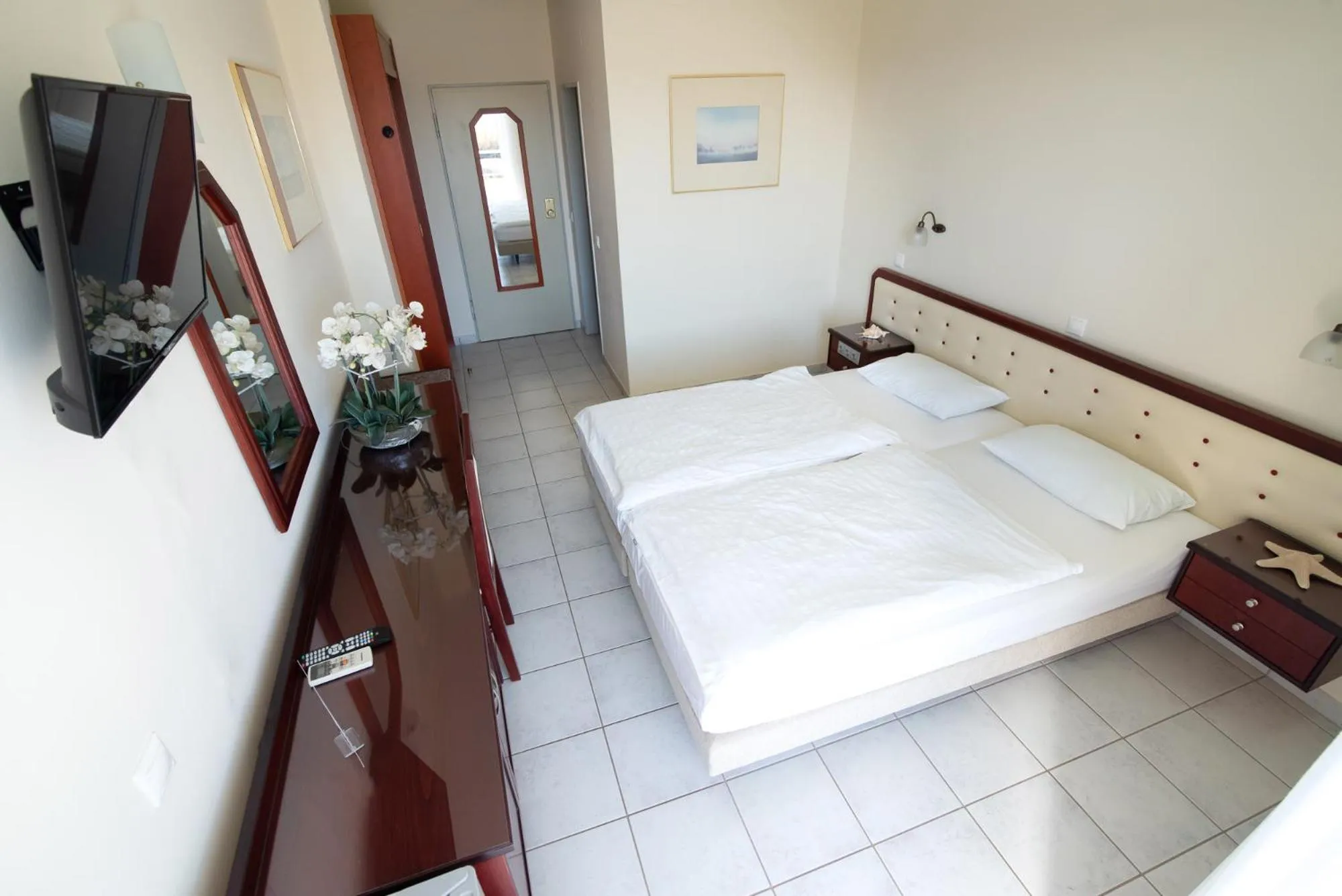 Bed in Dionisos Hotel