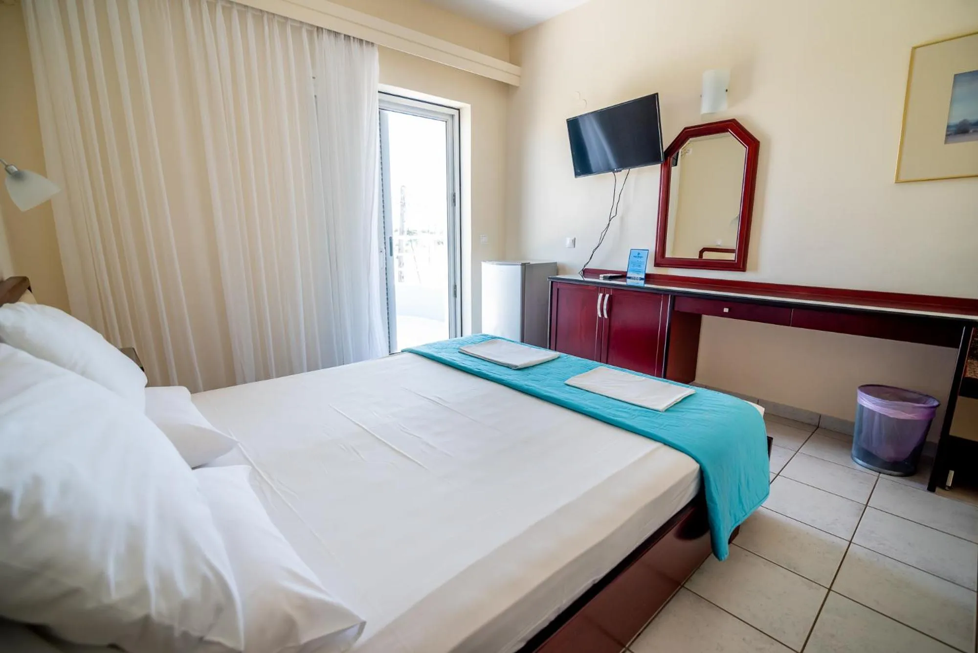 Bed in Dionisos Hotel